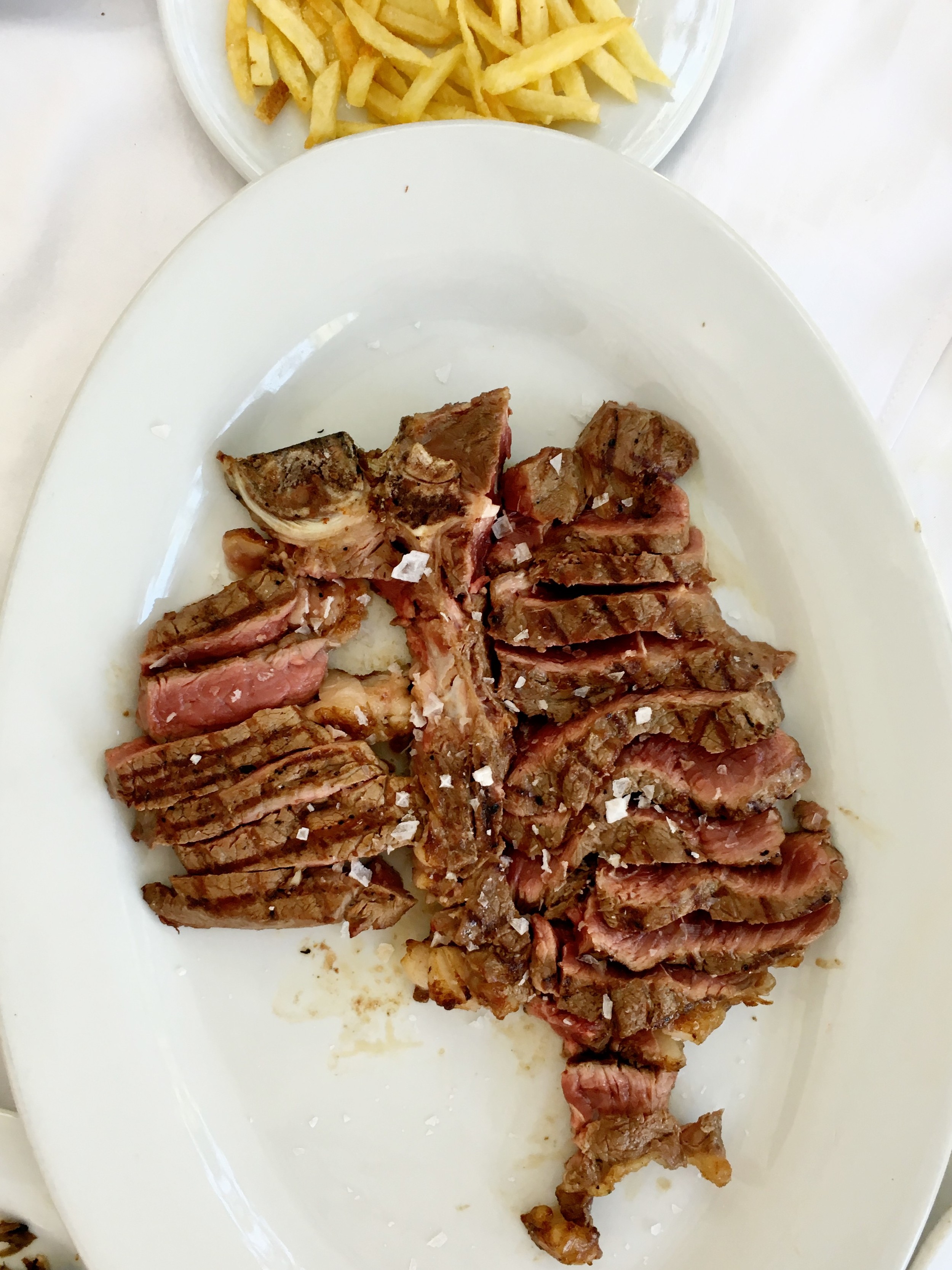 Mouthwatering T-bone steak, grilled to perfection and sprinkled with rock salt