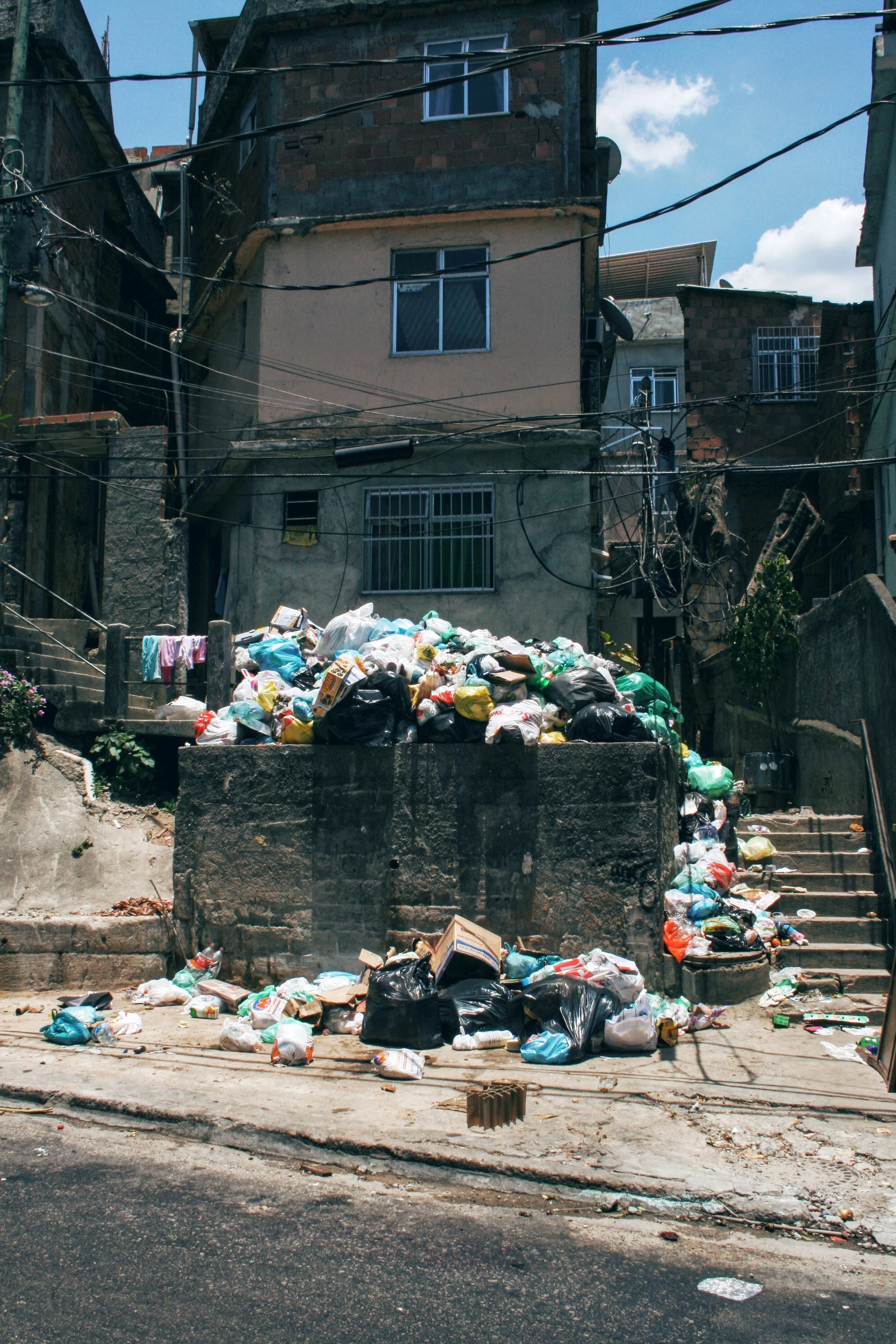 Stark contrast between the rich and the poor, favelas in ruins and full of garbage