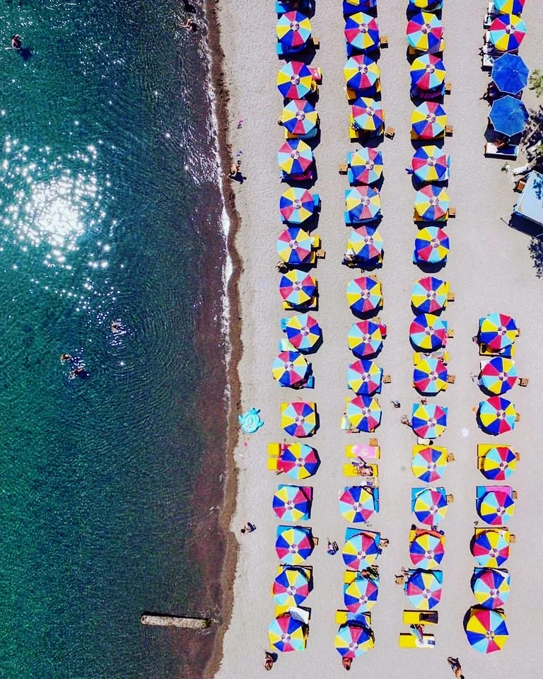 Colored umbrellas at Kambos beach