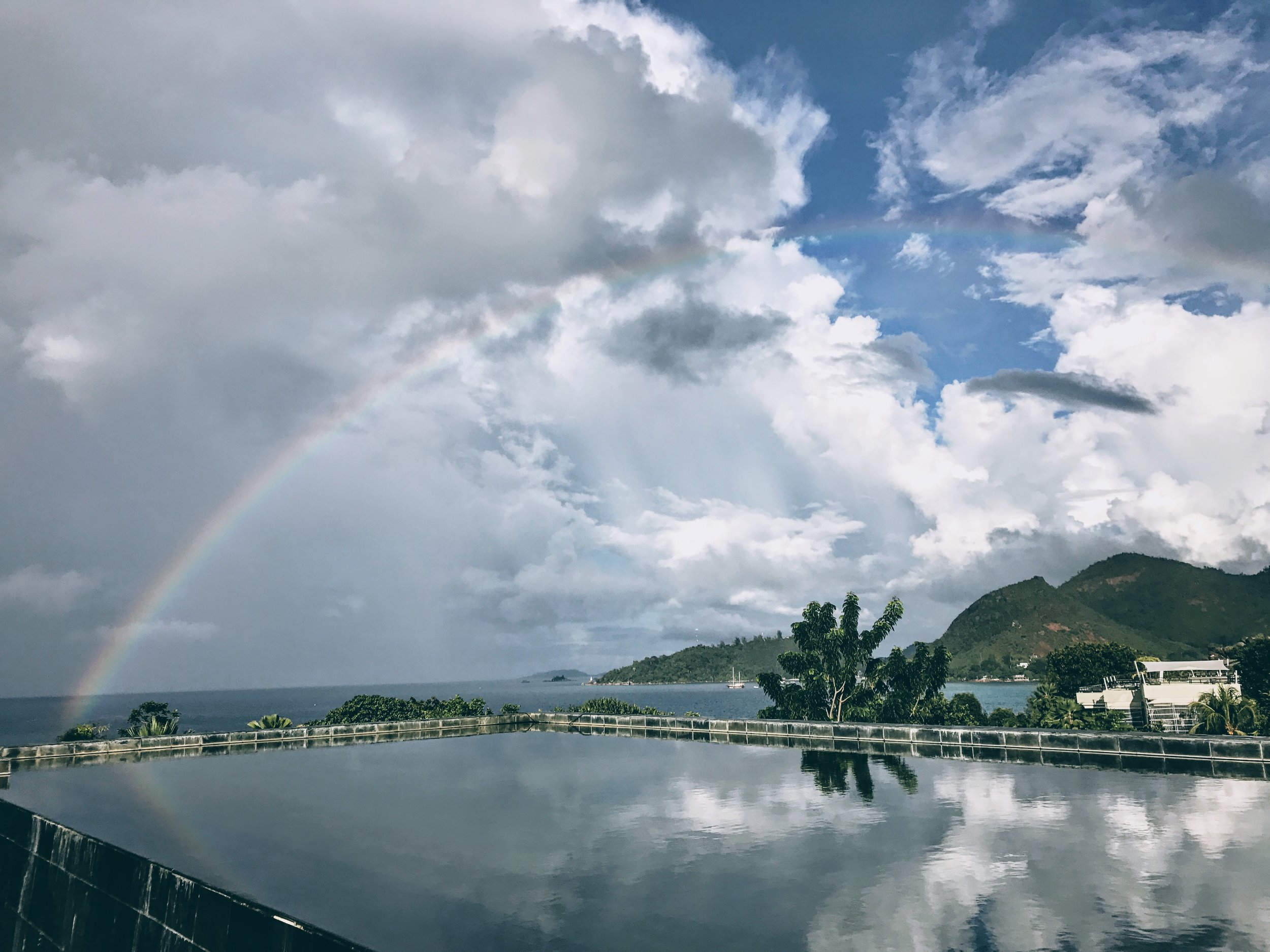 A rainbow appeared after a rain shower at this Zen like retreat.