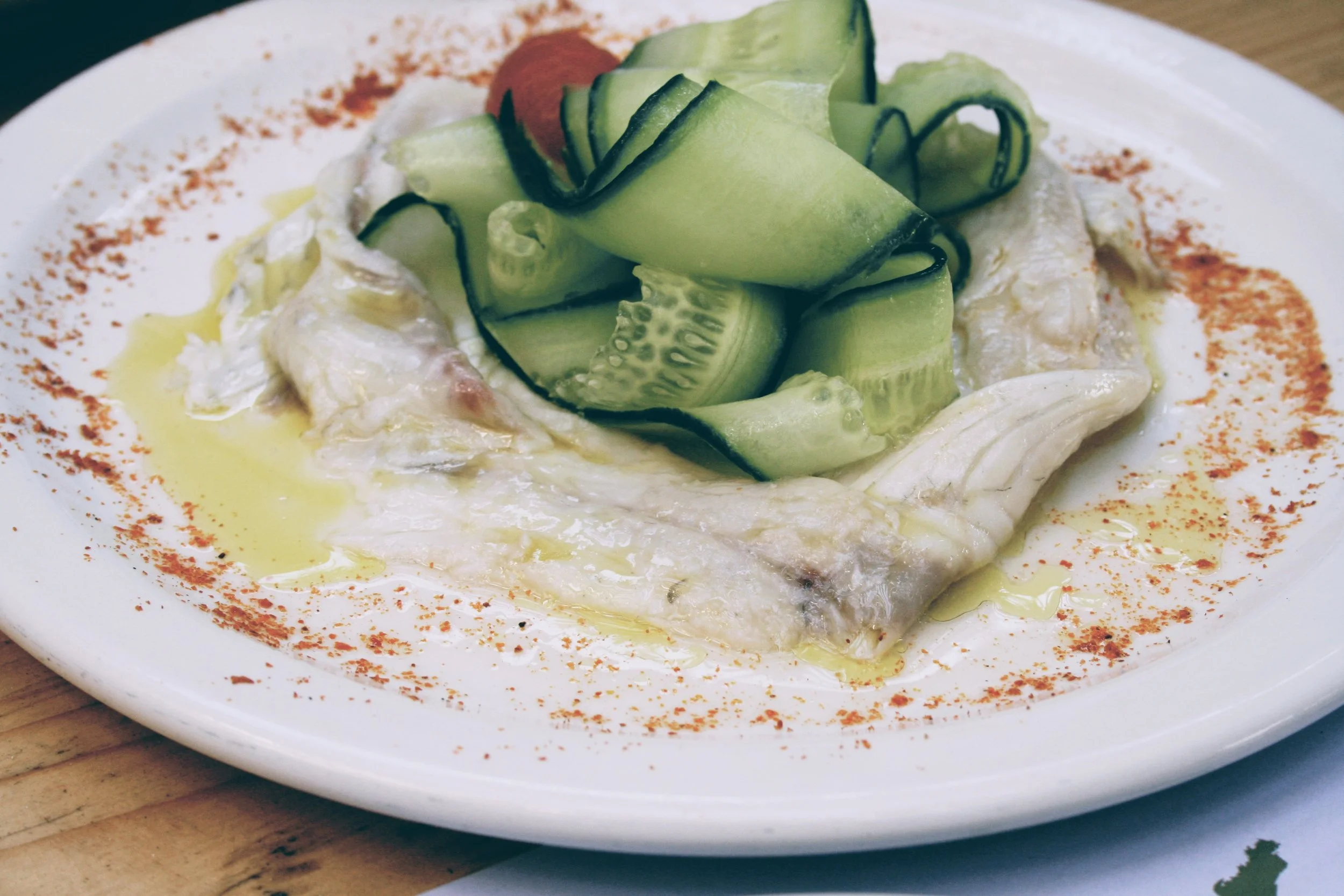 Seabass carpaccio sprinkled with some lemon and lime zest