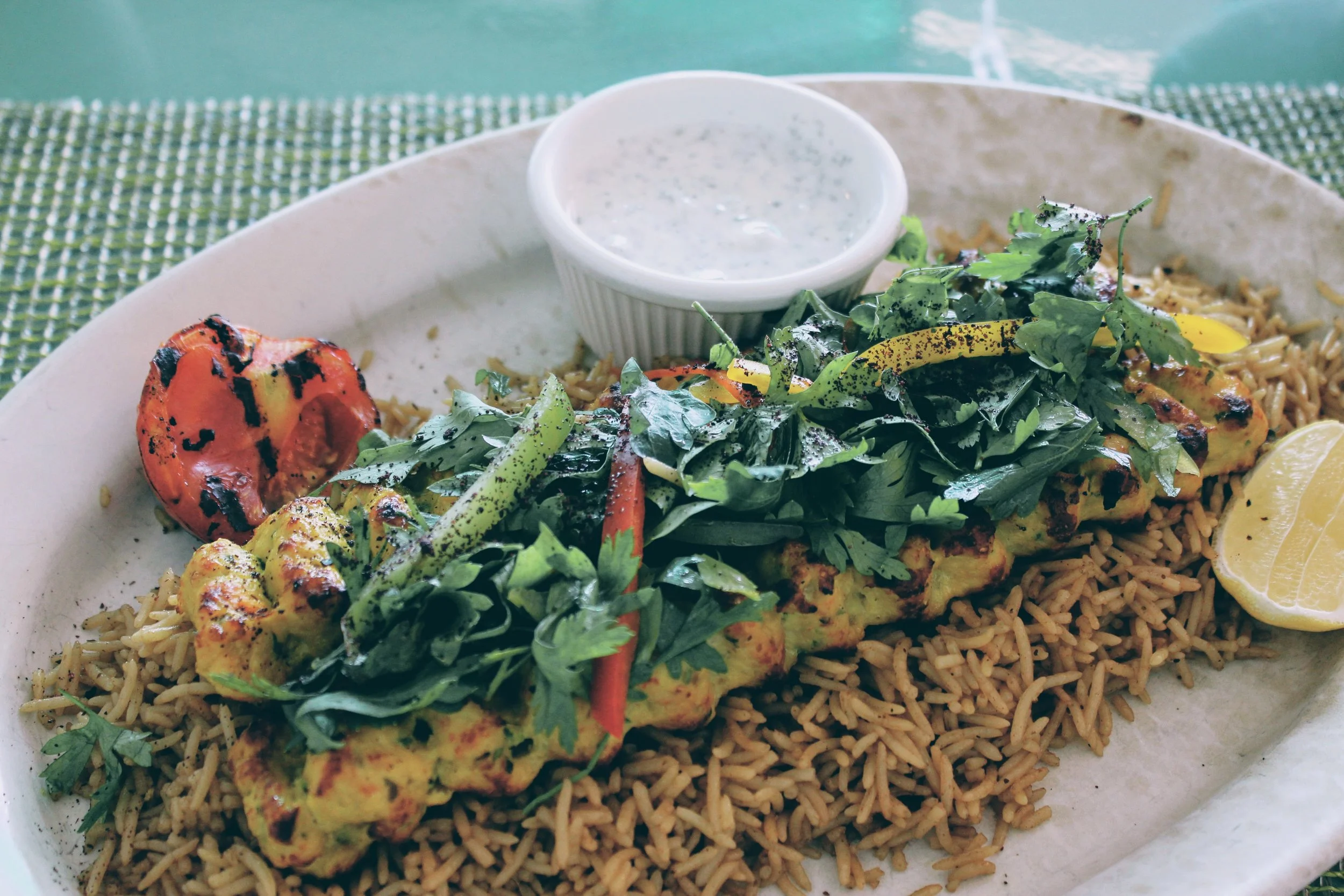 The Chicken Kubideh is an Afghani dish, as are the Mantoo dumplings and the bread and chutney.