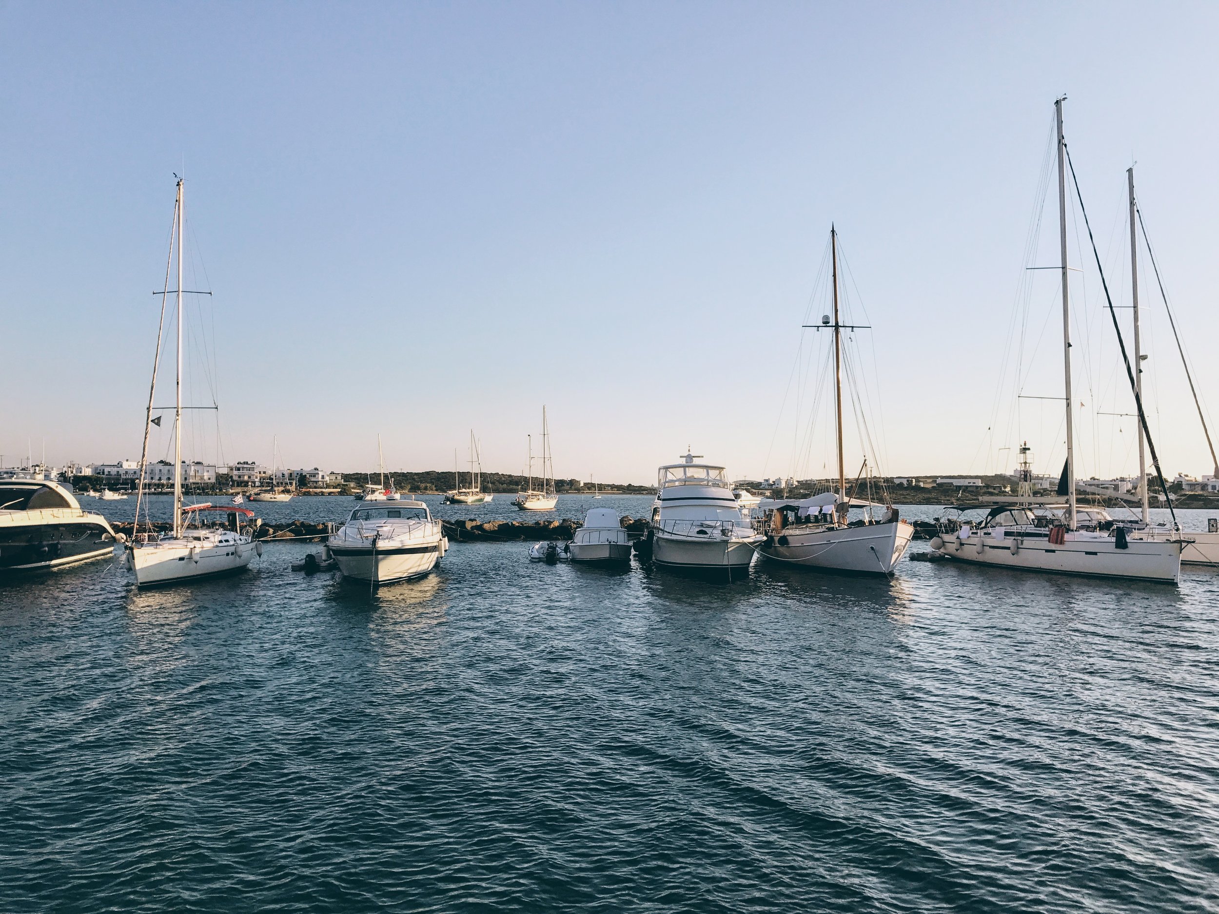 Sailing boats by the port