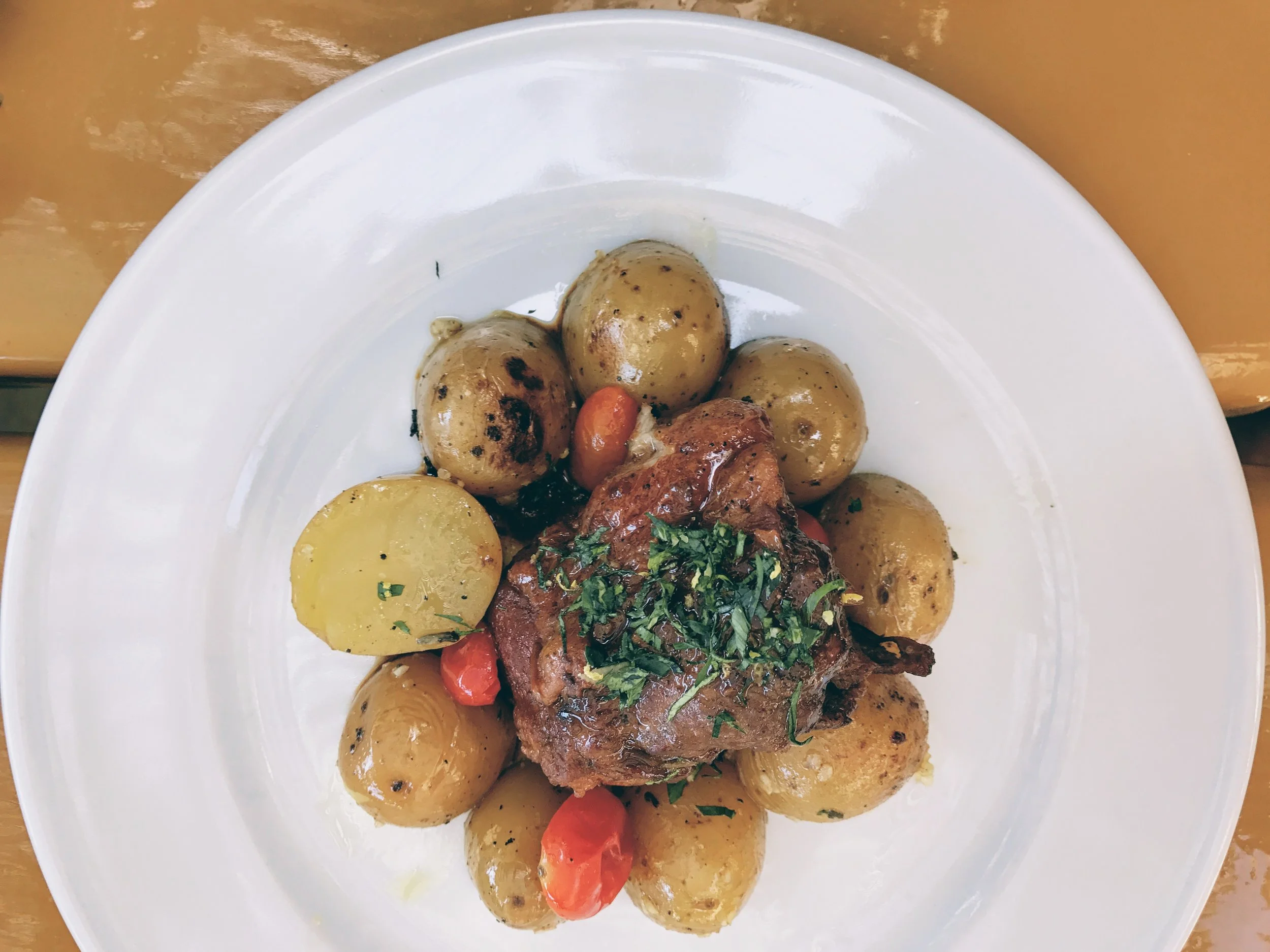Slow cooked veal with baby potatoes and pomodorini tomatoes