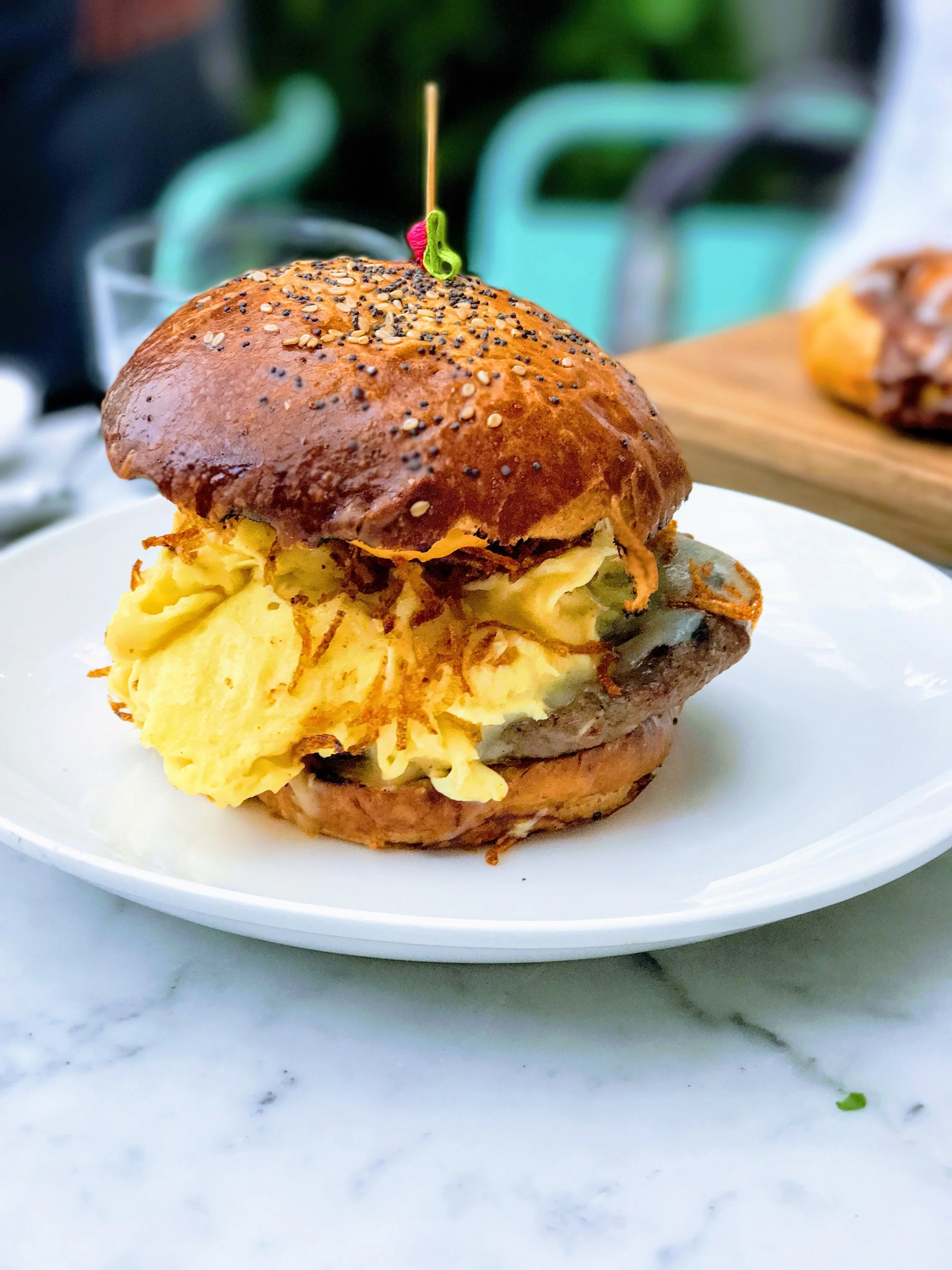 Egg & Sausage, Gochujang Aioli, Crispy Potato, Cheddar, Brioche