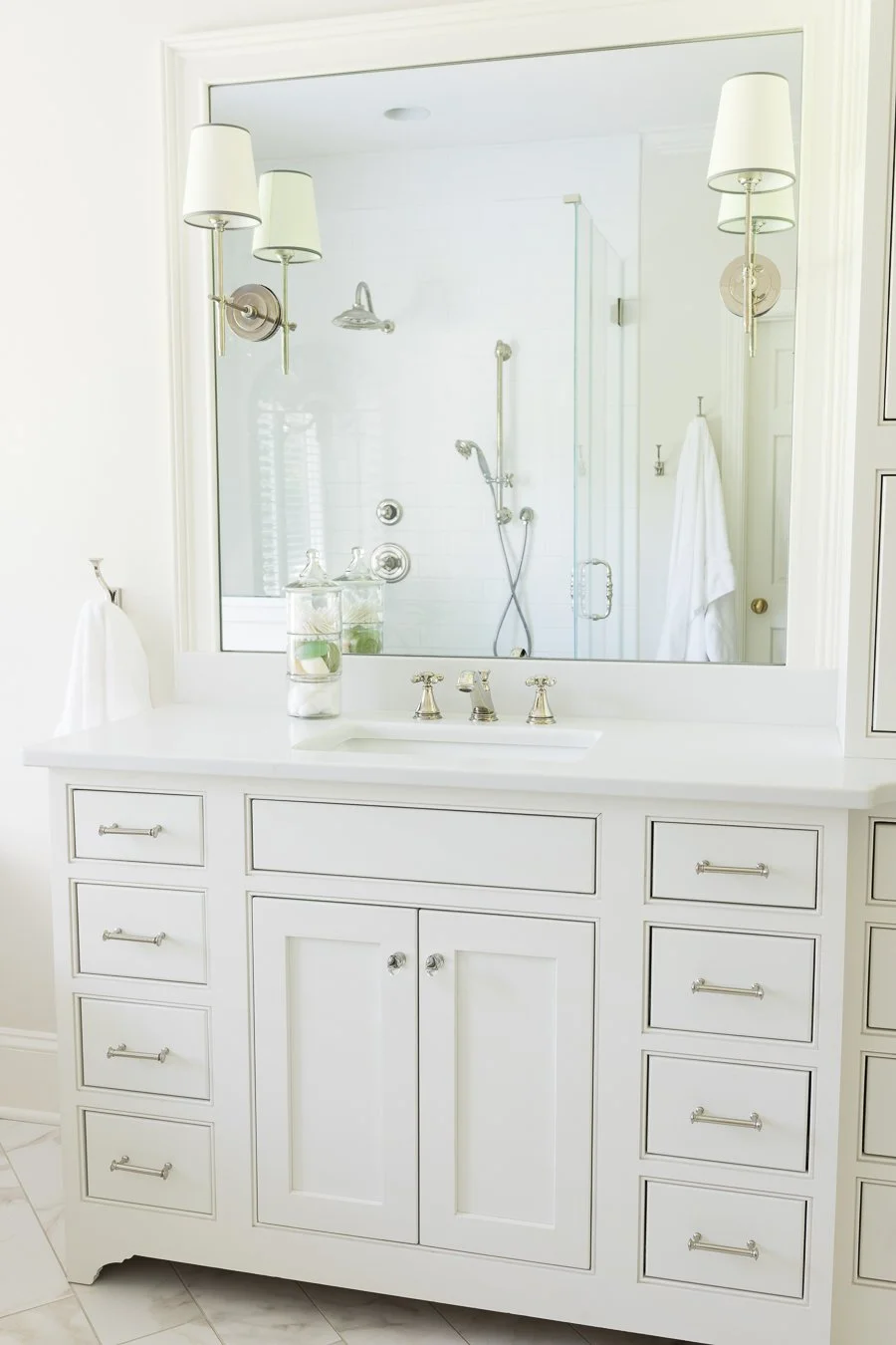 HIS & HER vanities now live on long wall that once had 2 doors into their separate baths.