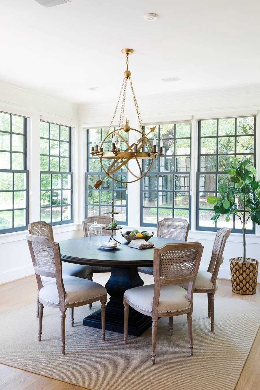 The armillary sphere will go wherever we go. Notice the dark mullions give a nod to iron windows without the price-tag.