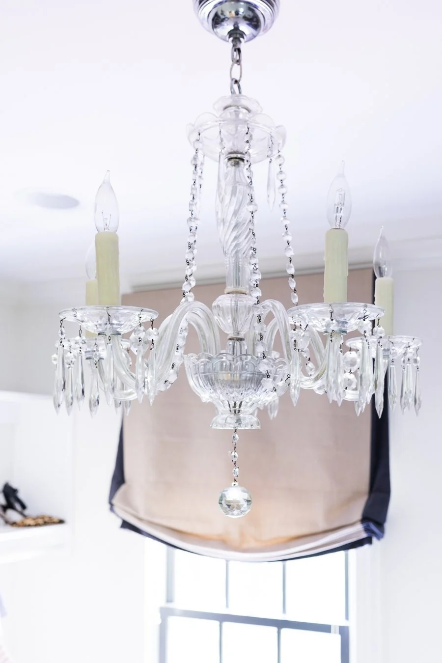 The window in the one large closet ... grandmother's chandelier dresses up the space :)