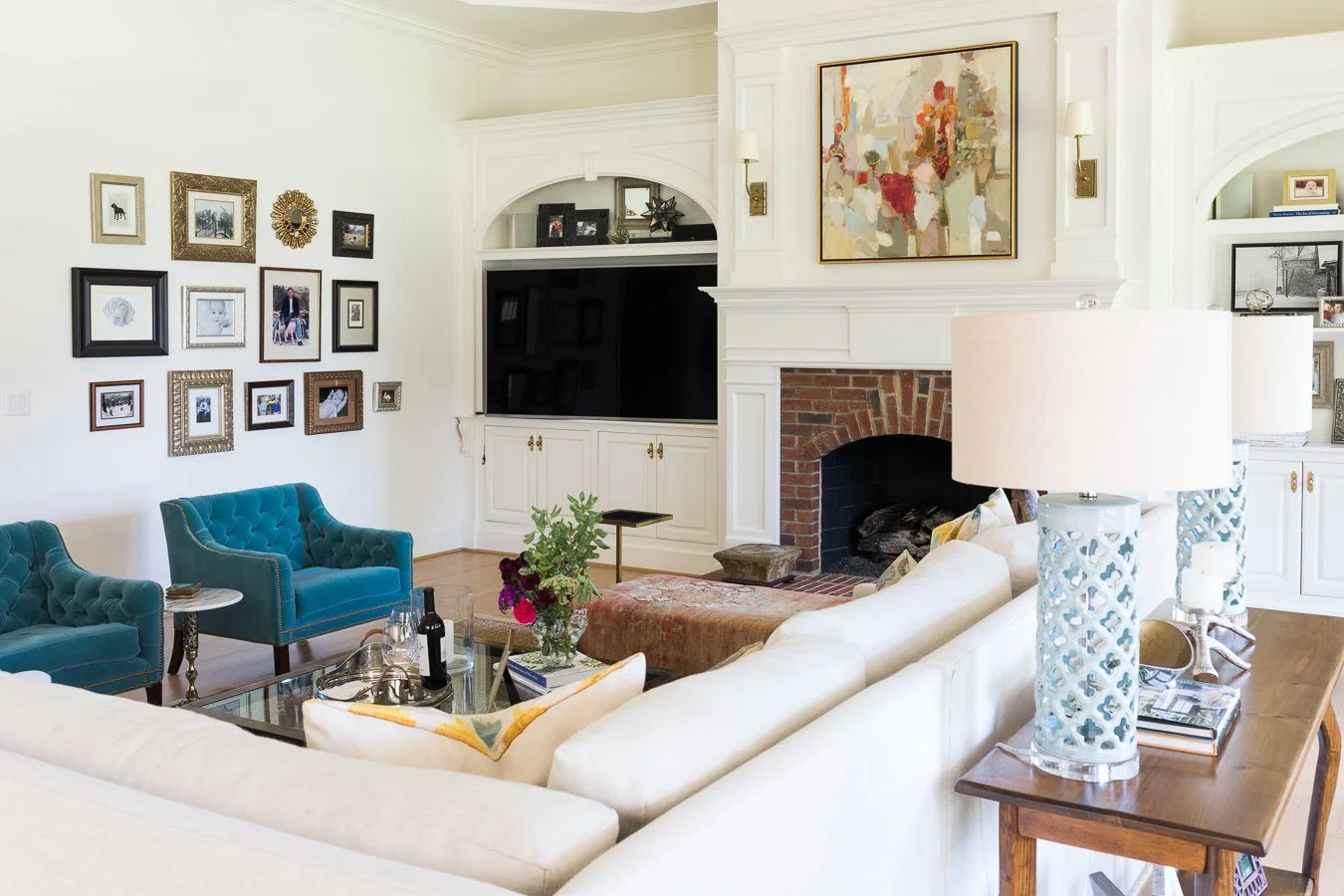 If possible, I always prefer the TV to one side. I am not a fan of it over the fireplace but often that is what makes the most sense.