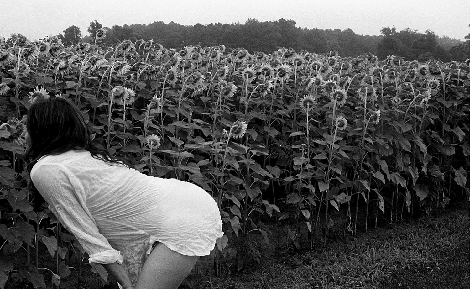 Robin Rice, Shira Smelling Sunflowers, Archival pigment print, 16" x 20"