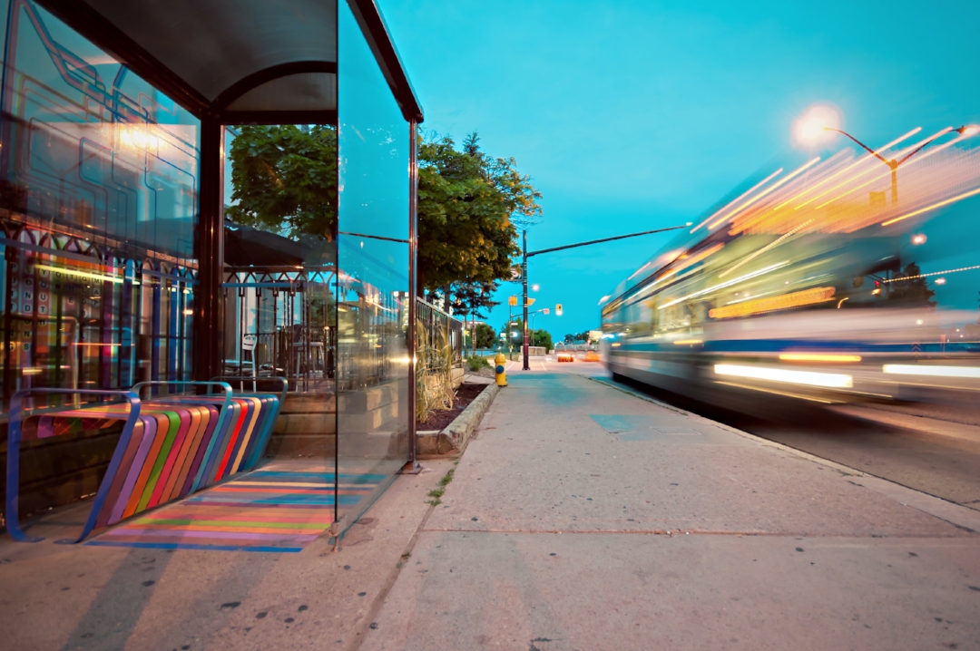 colors and architectural elements make this bus stop attractive and inviting