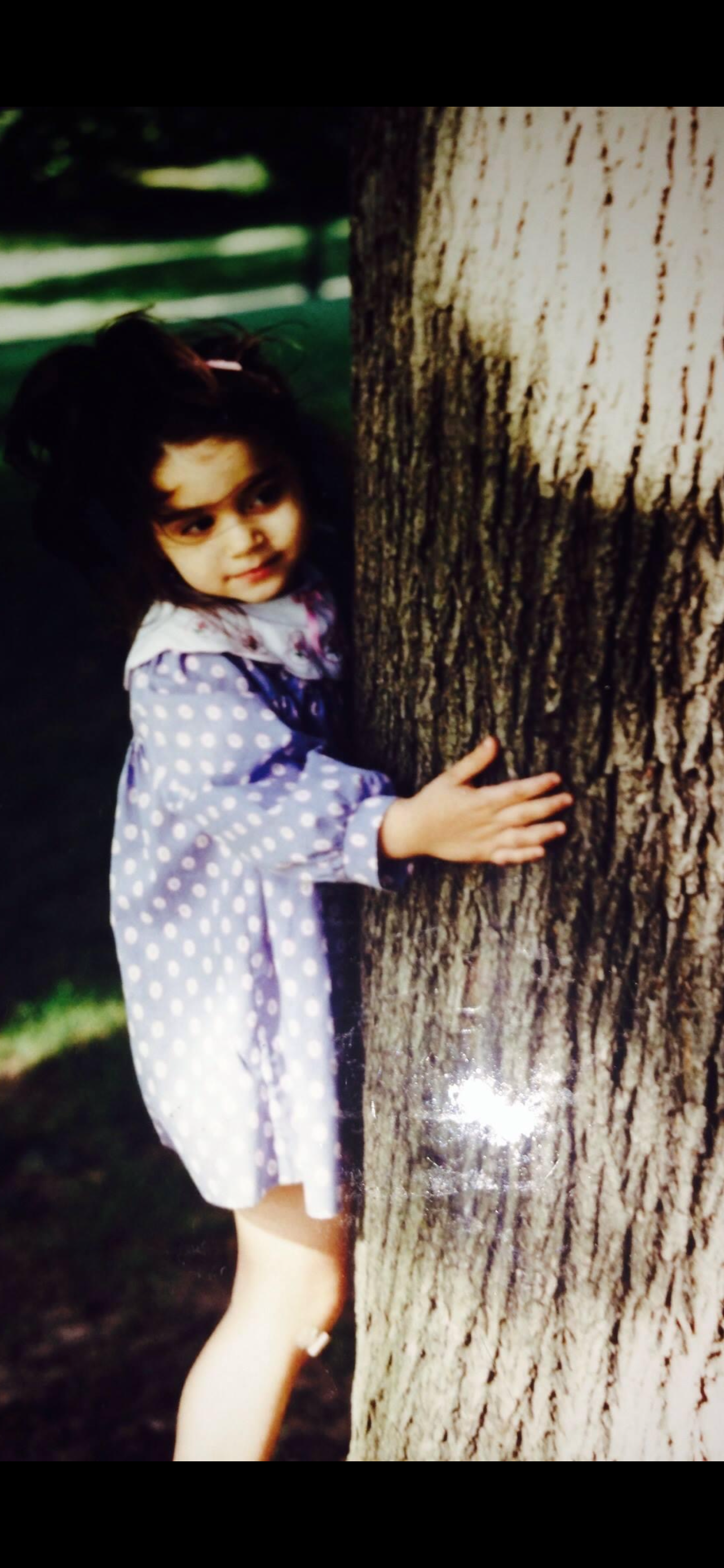 me age three hugging a tree.PNG