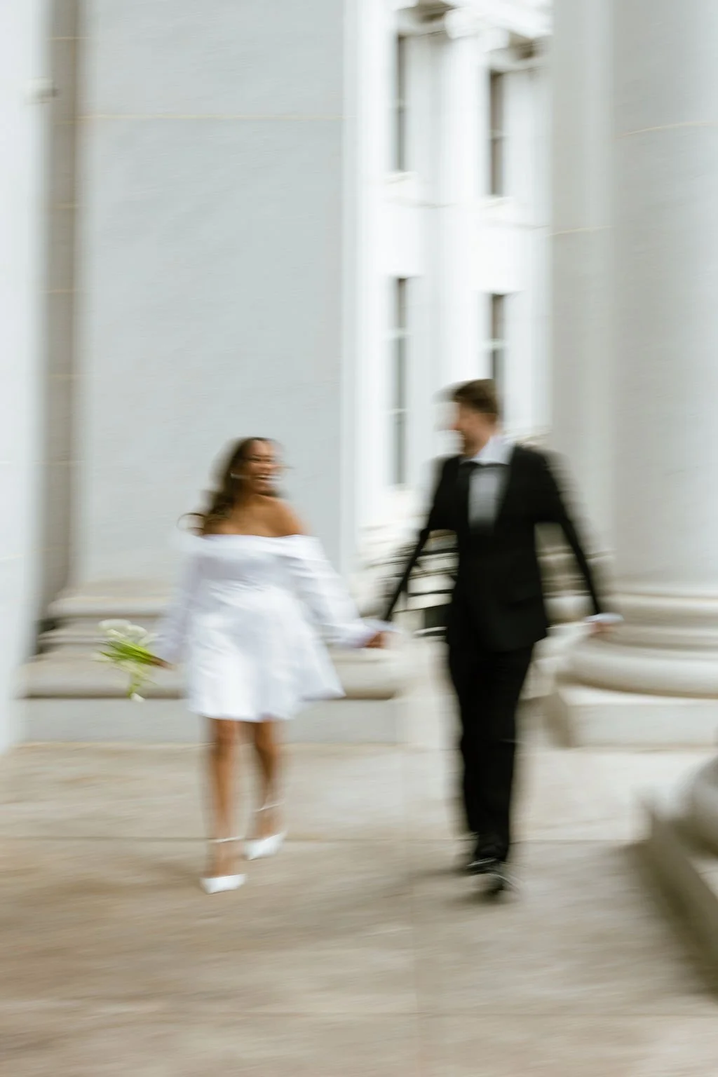 Dreamy motion blur of newlyweds at their Denver Courthouse wedding.