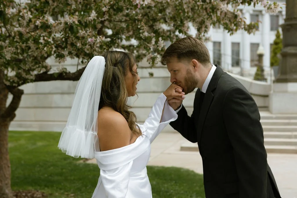 Romantic moment between bride and groom at their denver courthouse elopement.