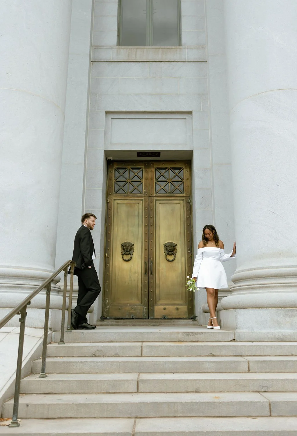 Editorial pose of Bride and Groom on the Denver Courthouse.