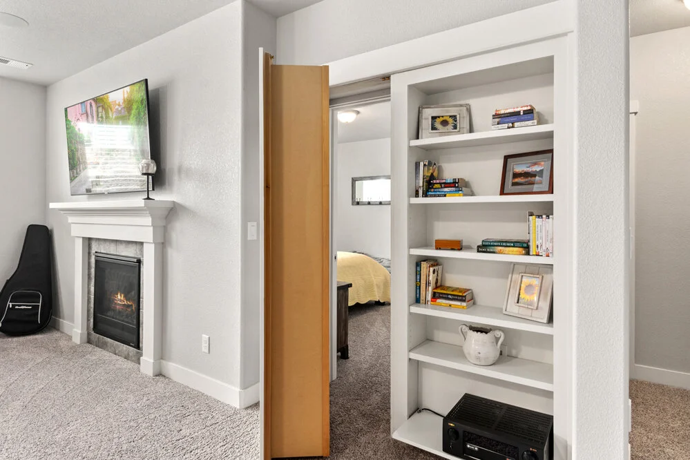 Secret Bookcase Door Leading into a Spacious Bedroom