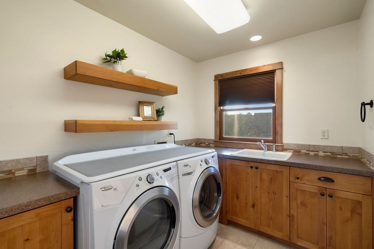 Large Laundry Room Conveniently Located Upstairs