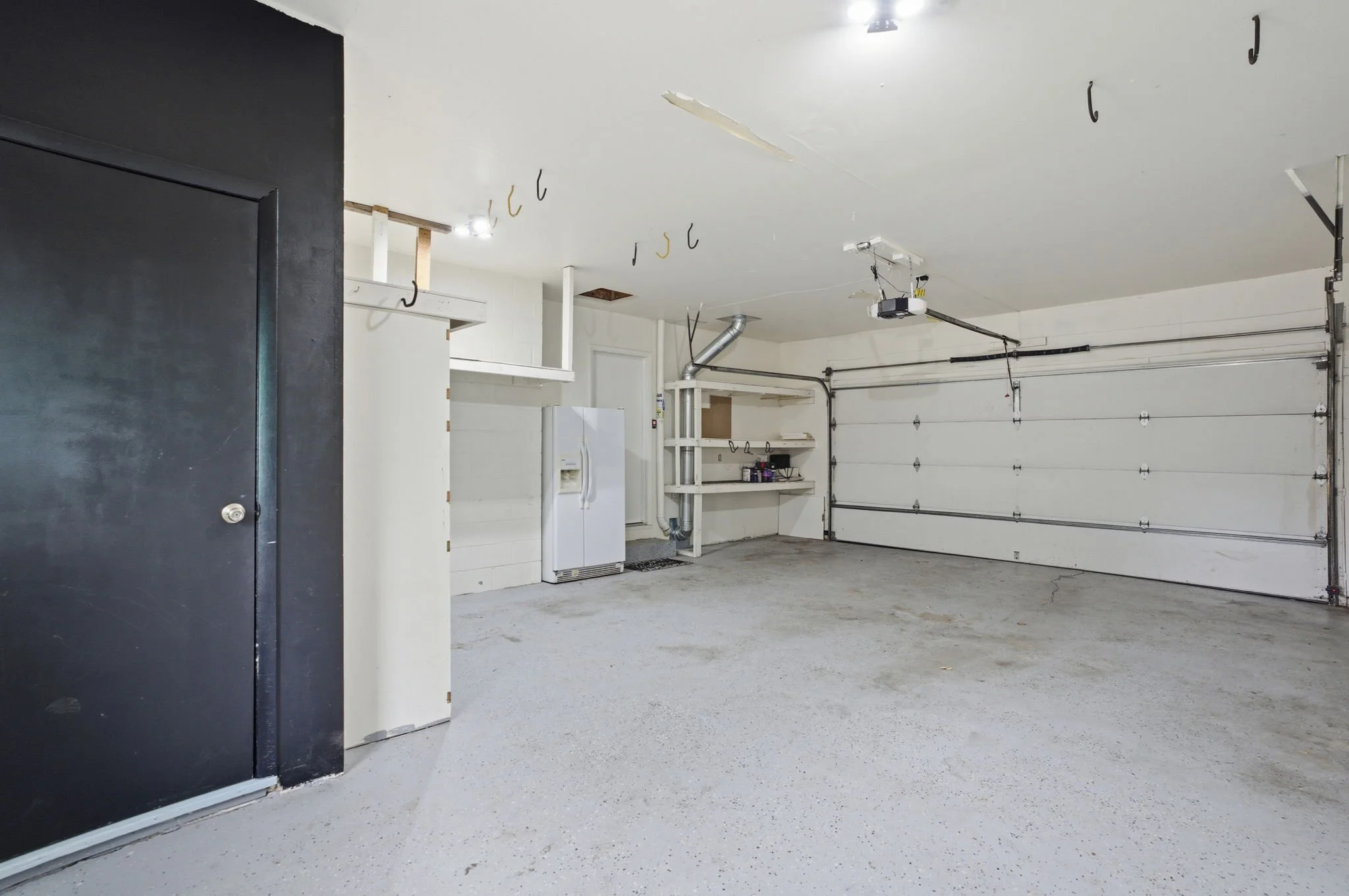 Oversized 2-car attached garage with an entrance to the mother-in-law suite in the basement