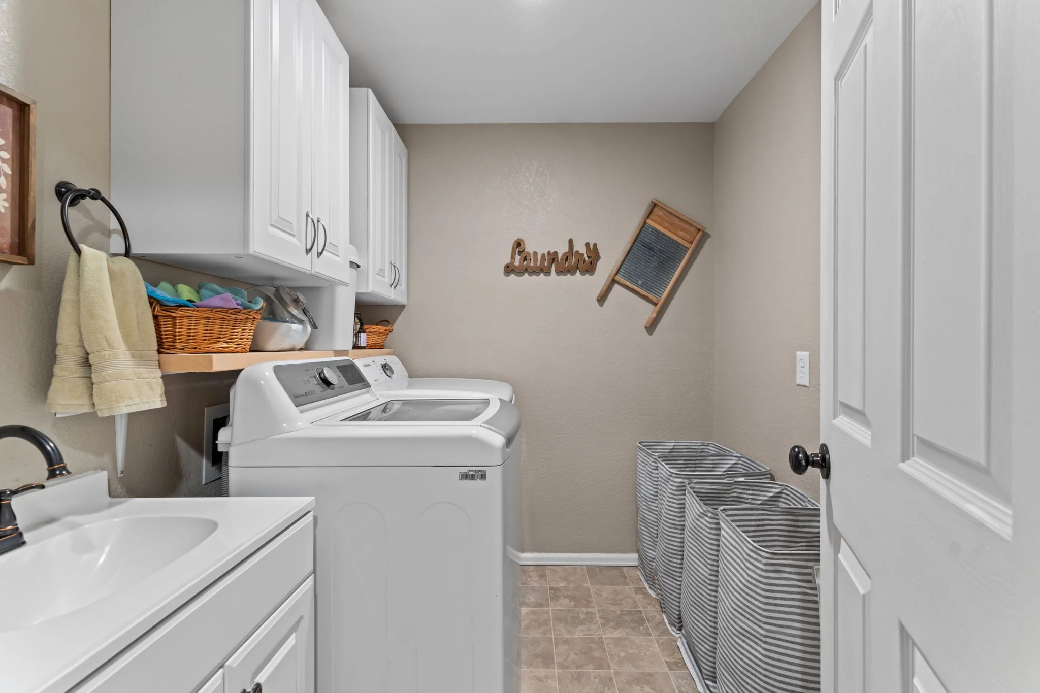 Spacious laundry room with a utility sink