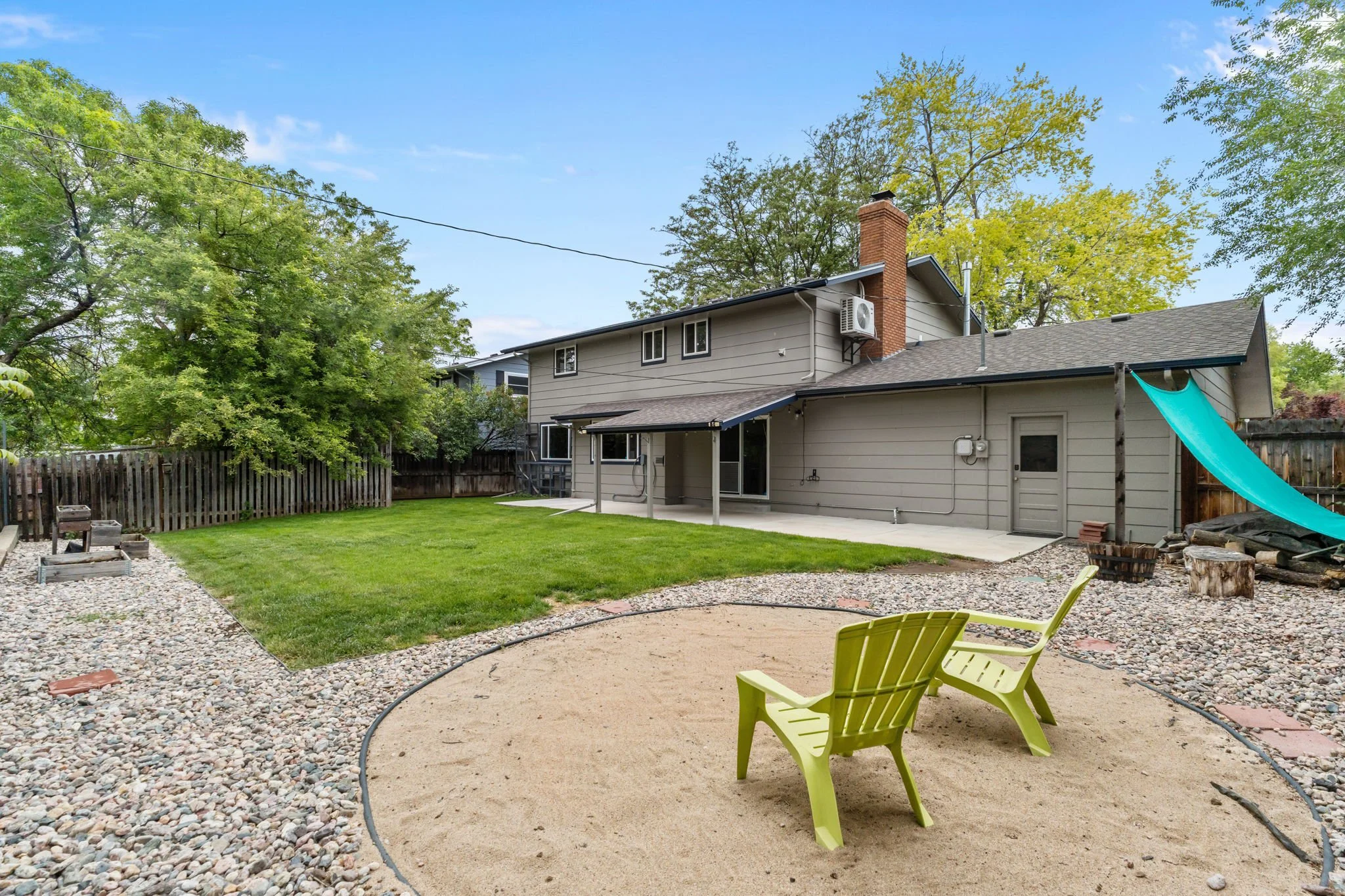 The backyard is set up for both relaxation and function