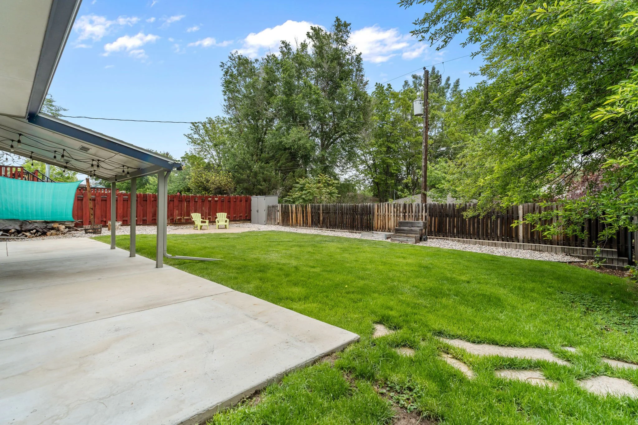 The backyard offers a fire pit area, chicken run, and dedicated hot tub pad with electricity in place