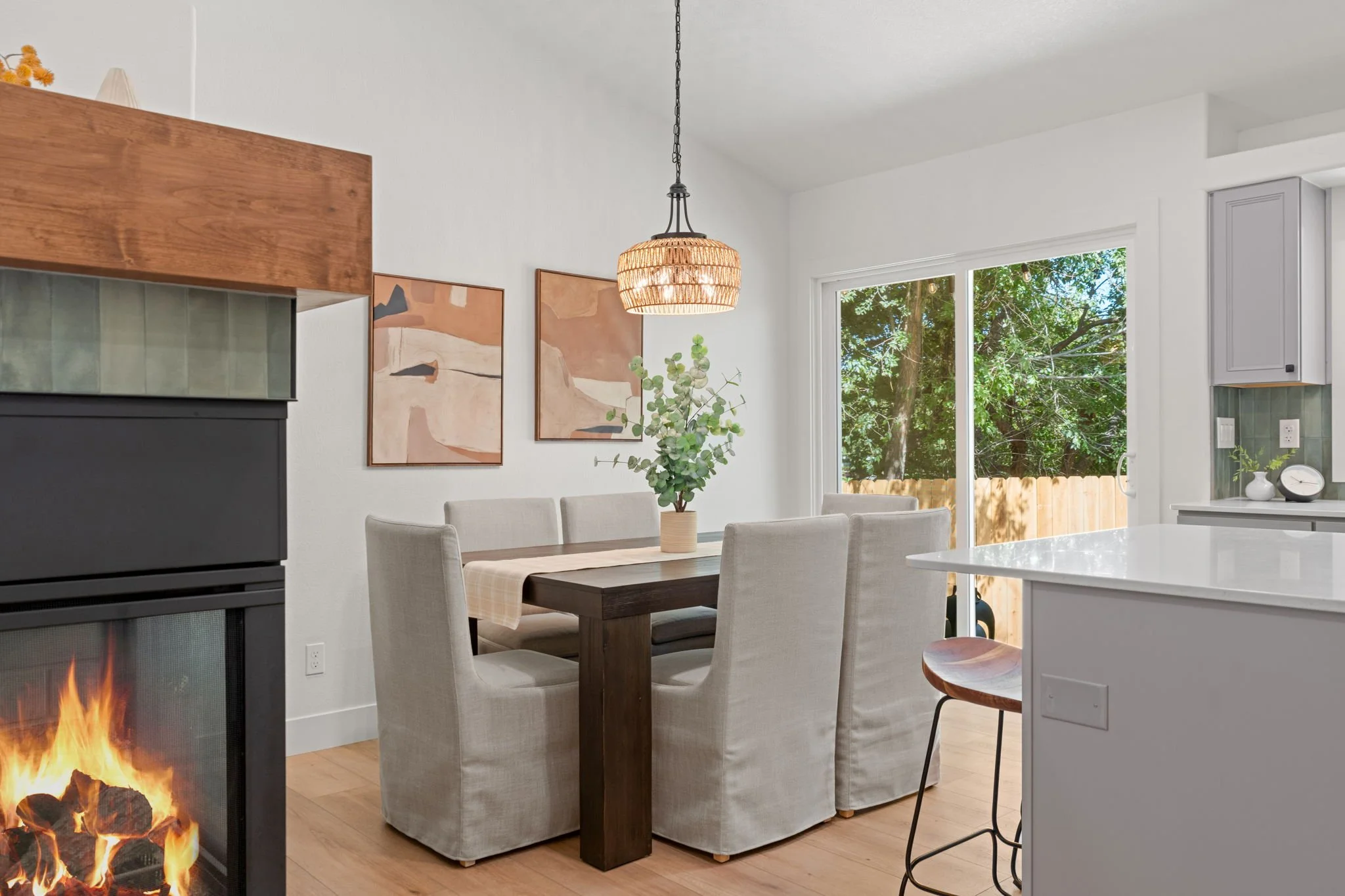 Dual-sided gas fireplace in the living and dining spaces