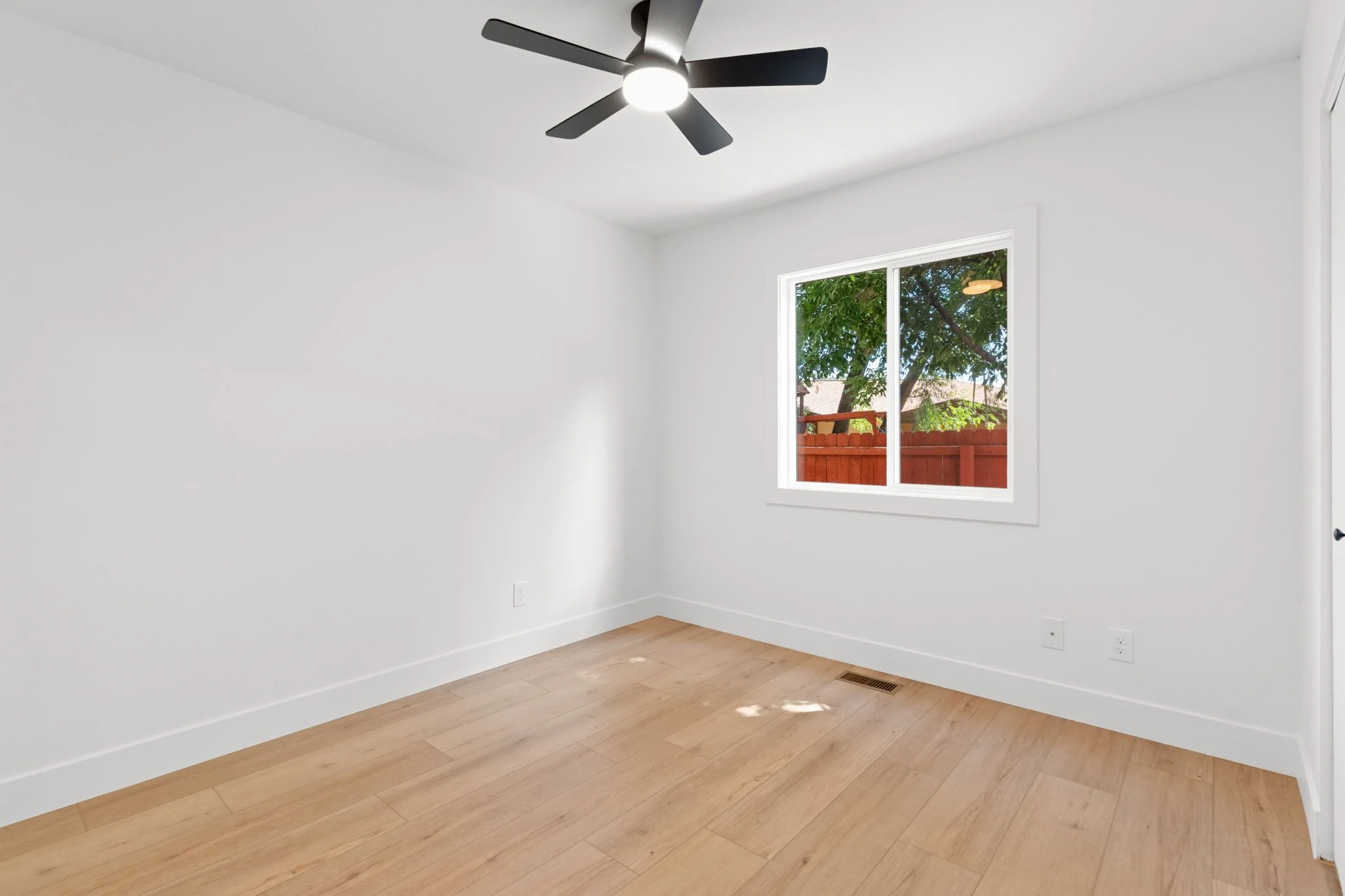 New furnace, a/c, class-4 roof, windows, kitchen, bathrooms, LVP flooring, fixtures, hardware, landscaping, privacy fence, and MORE!