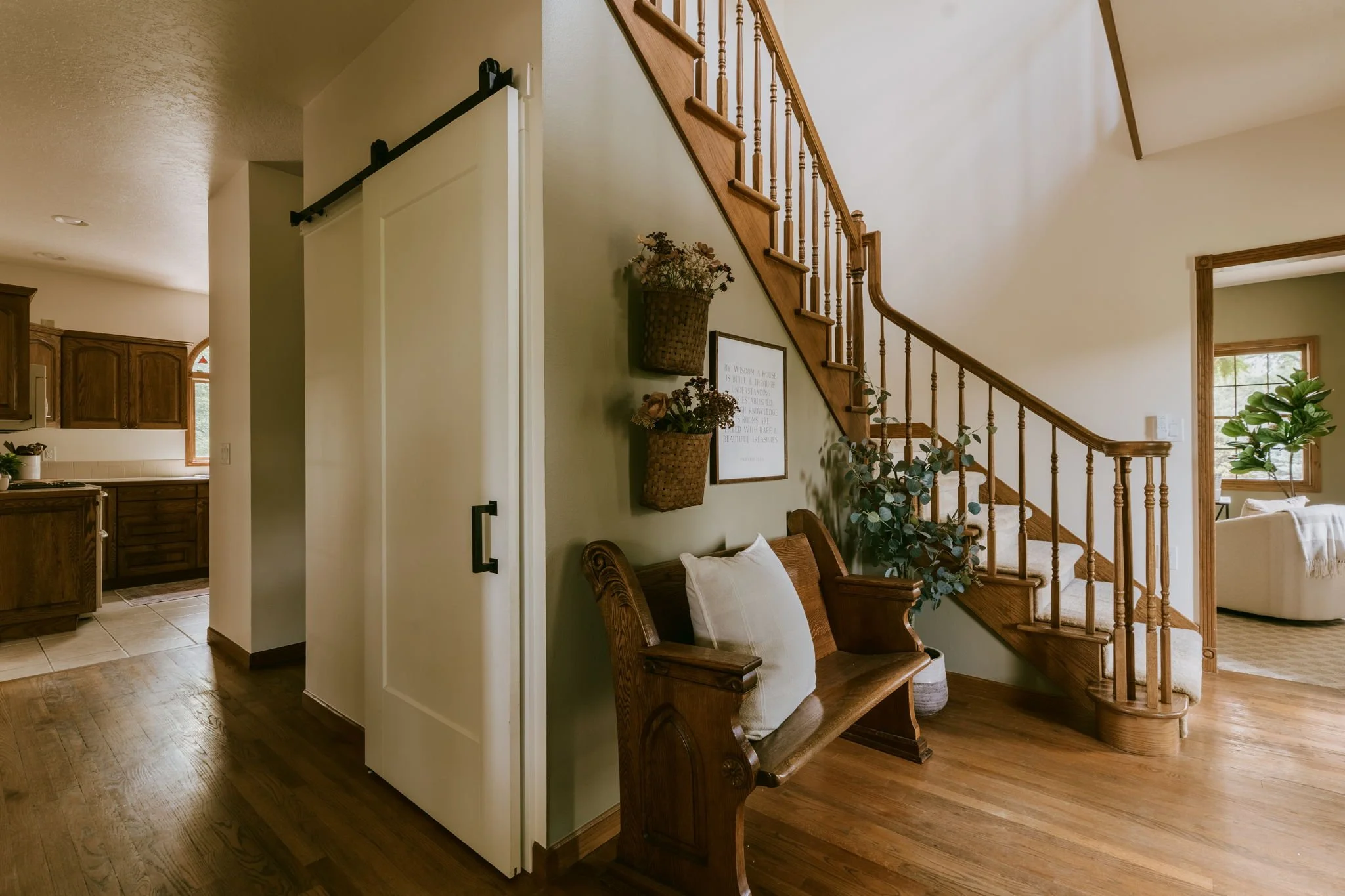 Wood floors and custom walk in pantry w/ barn door