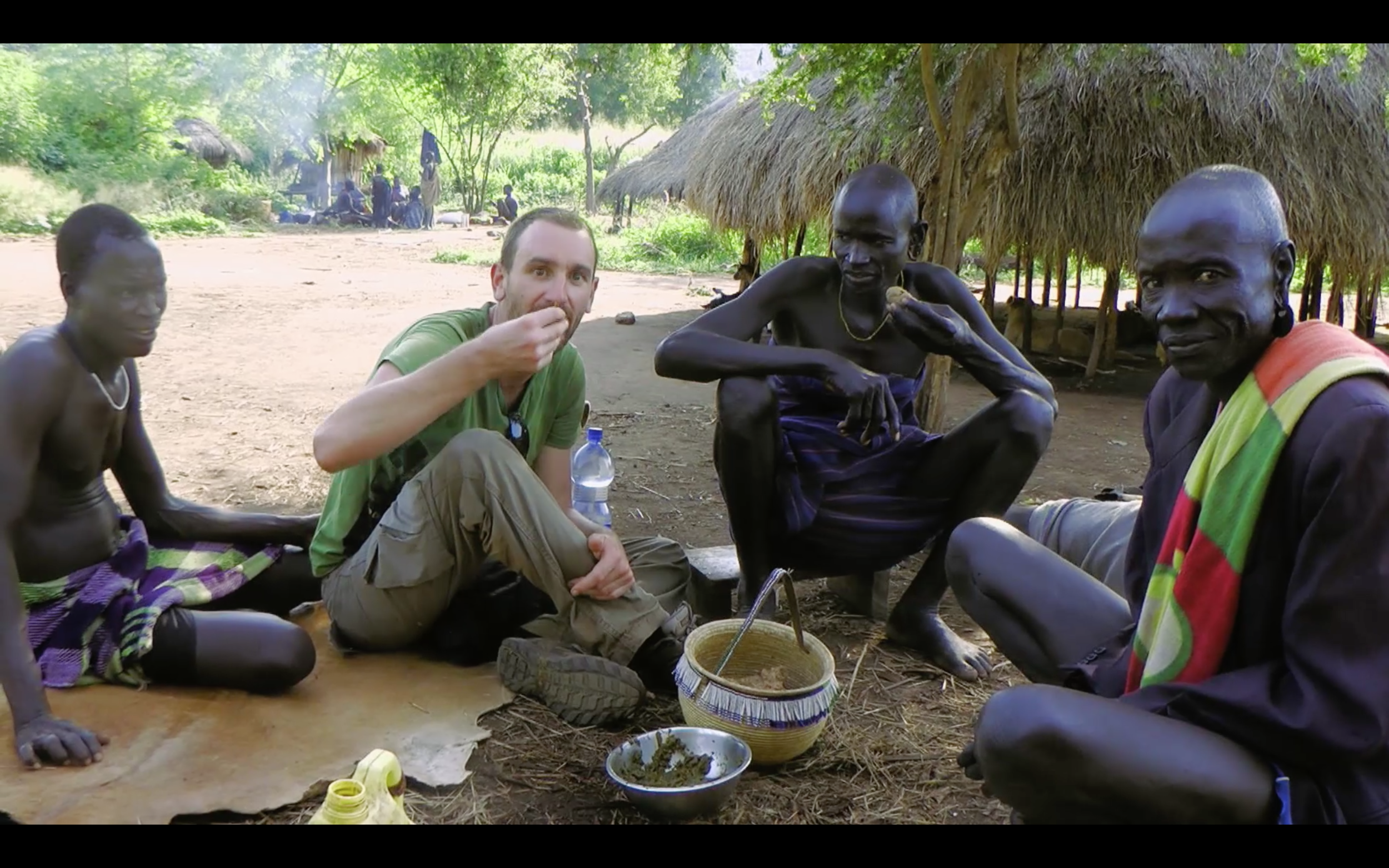 Eating tilla in a Mursi village - Walking With The Mursi