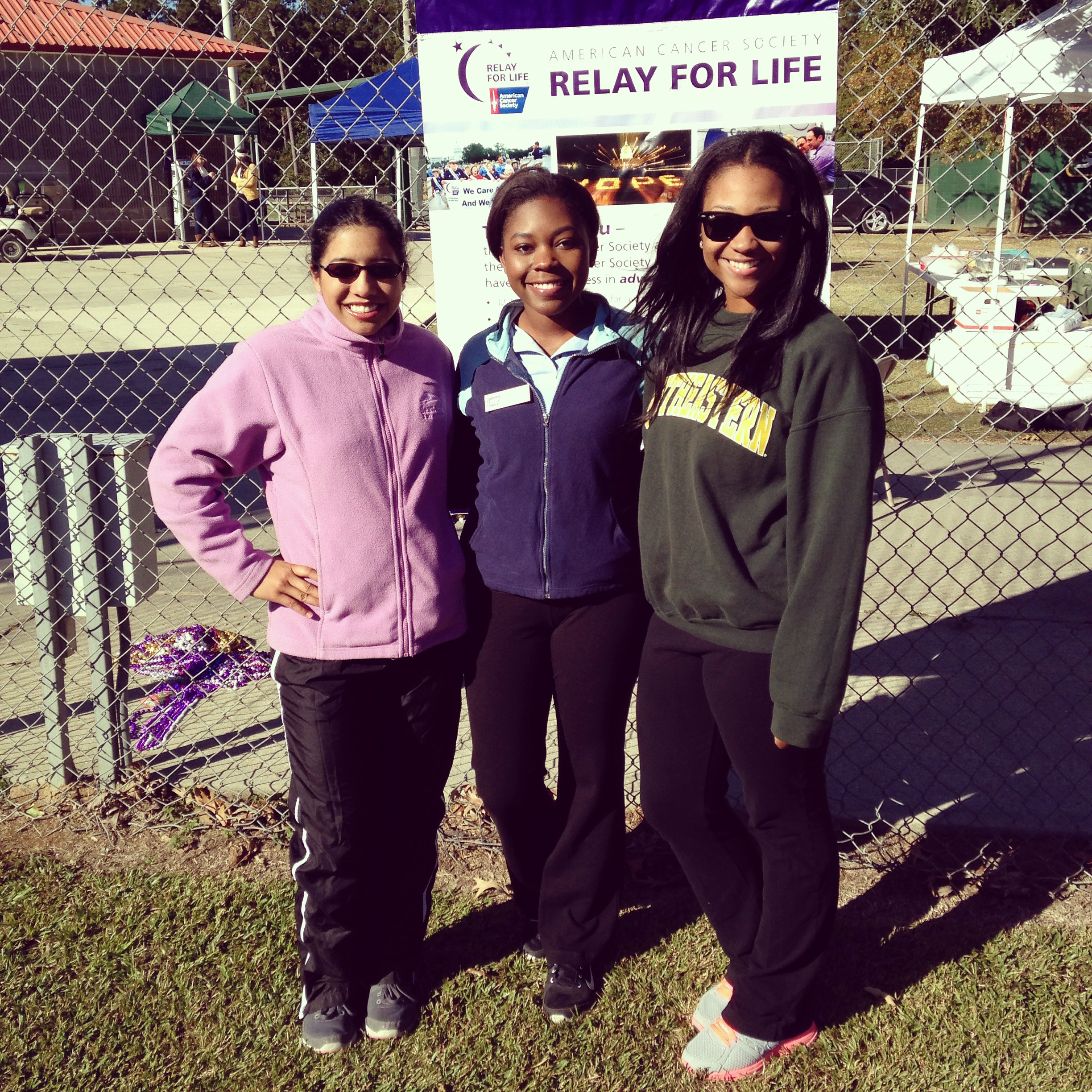 Jasmine poses with PRSSA members, Maria Goddard and Jada Davis, at the 2014 Relay For Life.&nbsp; 