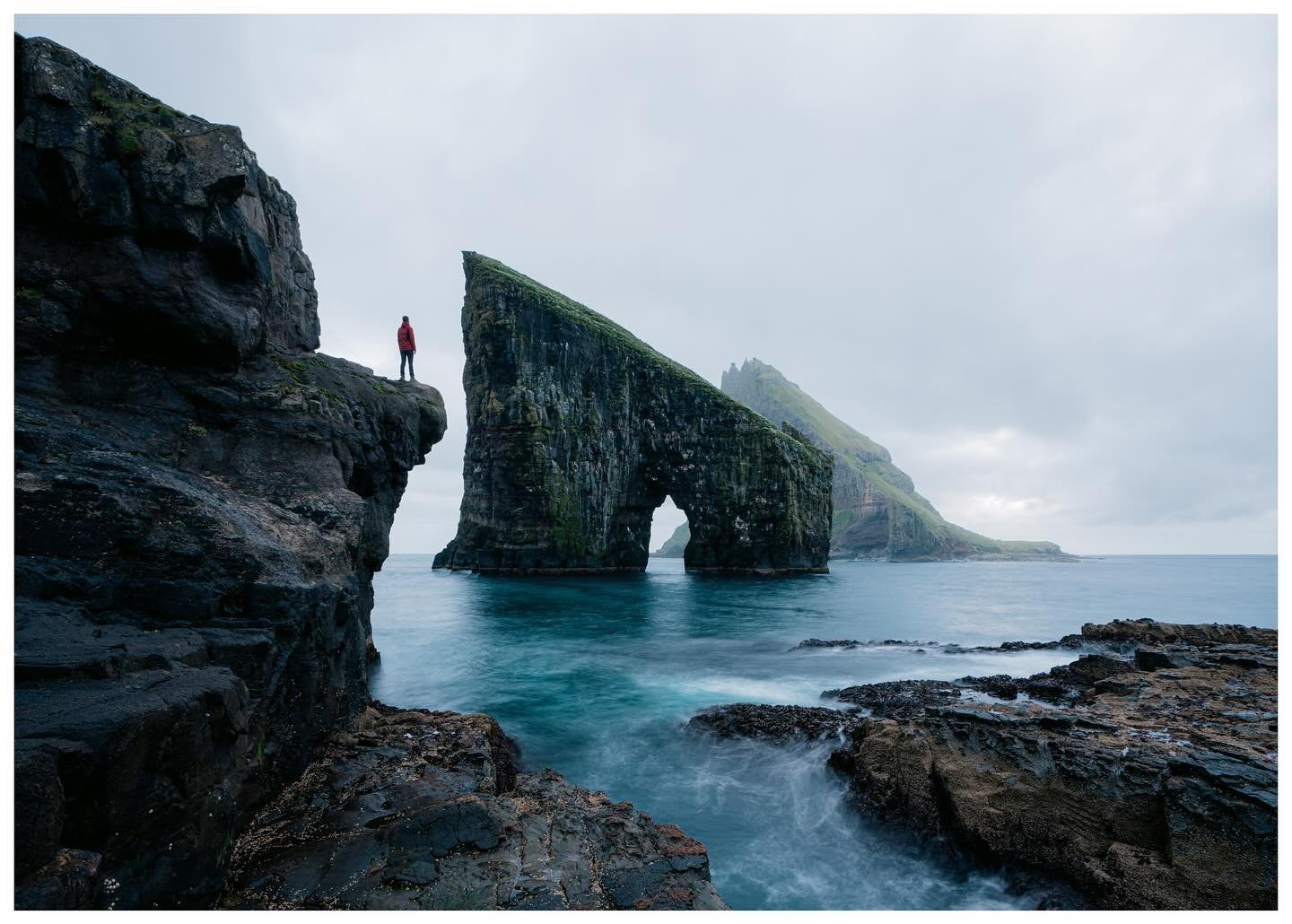 Nothing to see here, just an old view from the Faroe Islands

It's not a great shot, the conditions were terrible, but climbing up to that ledge is still something that makes my heart beat a little bit faster #faroeislands #drangarnir 
.
.
.
.
.
#far