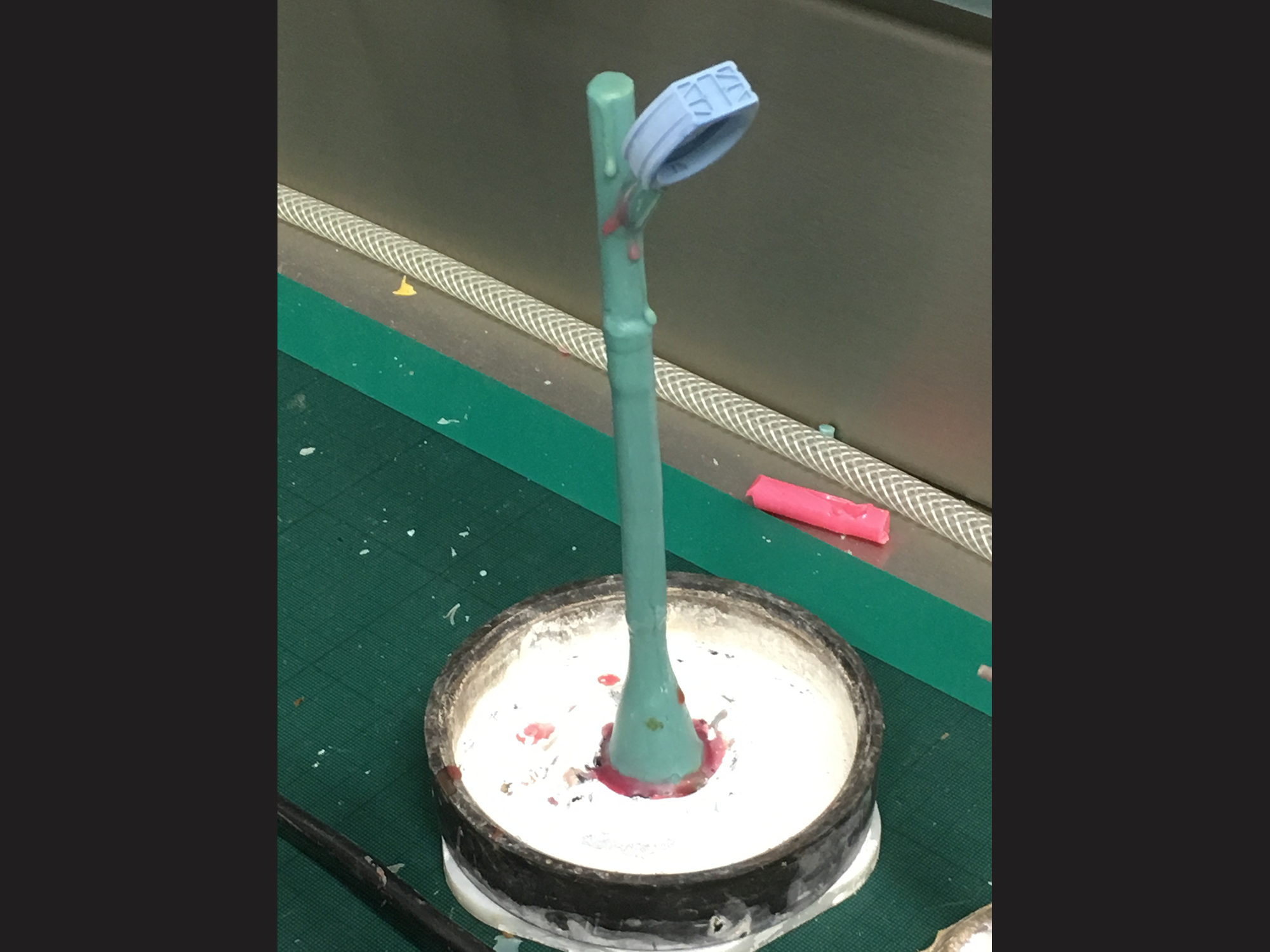 mounting the wax model on a tree