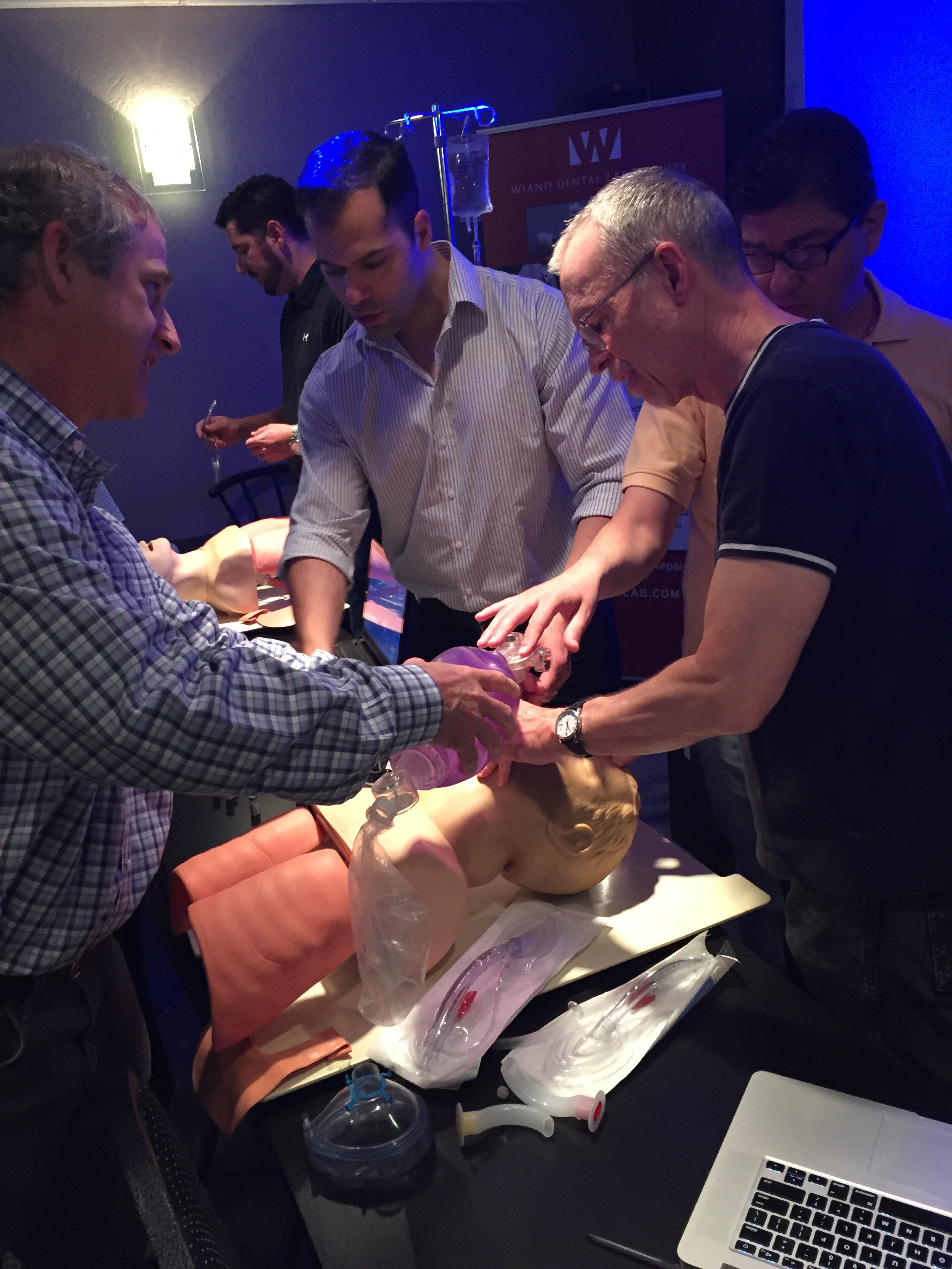 Joe Rodriguez, CRNA, offering hands-on airway instruction. Pictured here with Dr. Ralph Price and Dr. Alan Ferguson. 