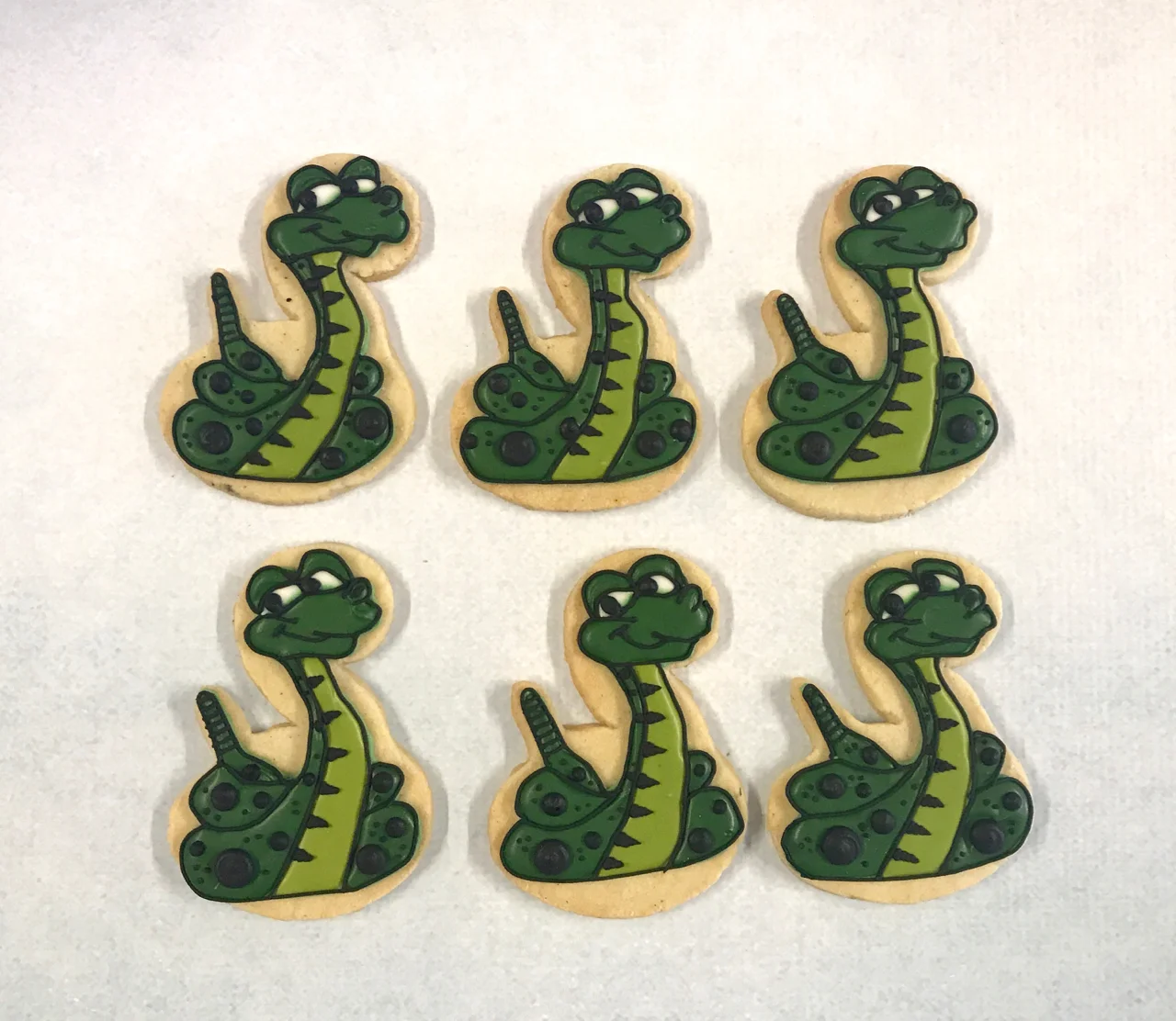 Hand piped The Jungle book Kaa biscuits