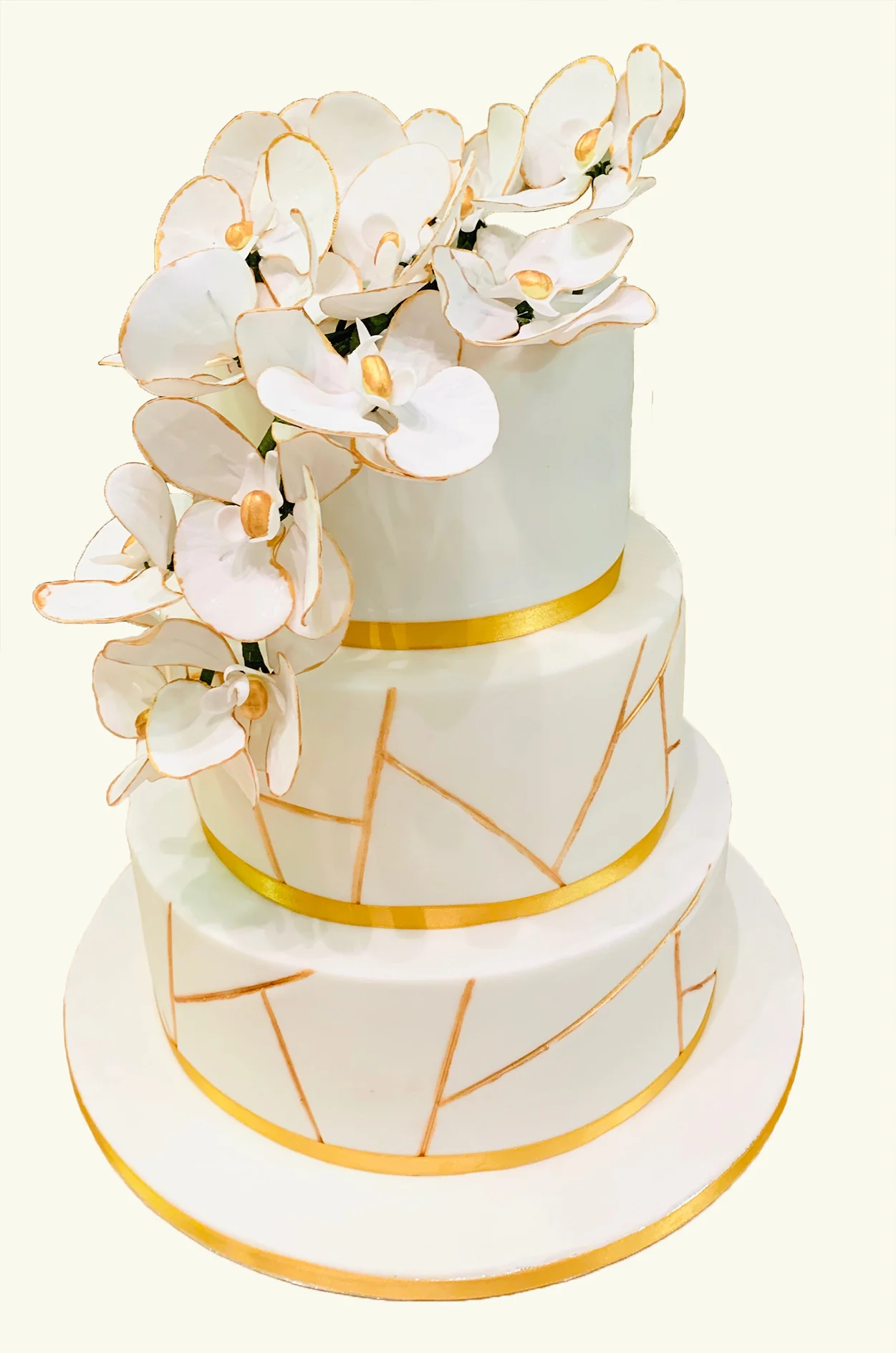 3 tier wedding cake with sugarflower orchids with gold edges 