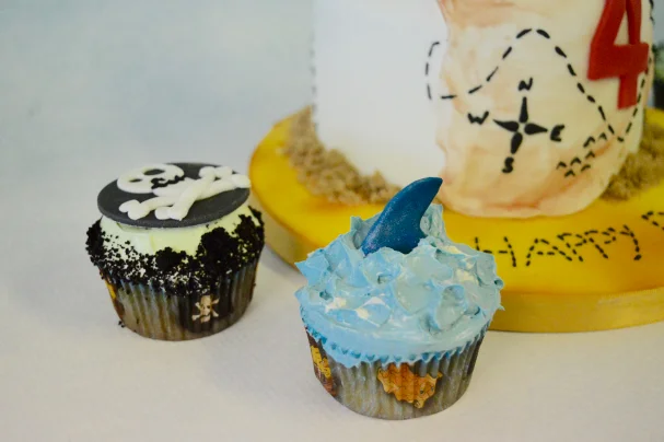 Pirate themed cupcakes, skull and cross-bone and shark