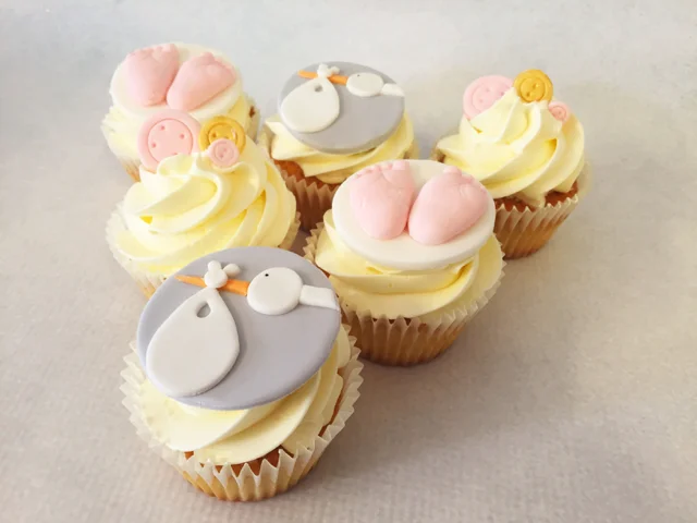 Baby shower cupcakes with stalk, mini buttons and baby feet