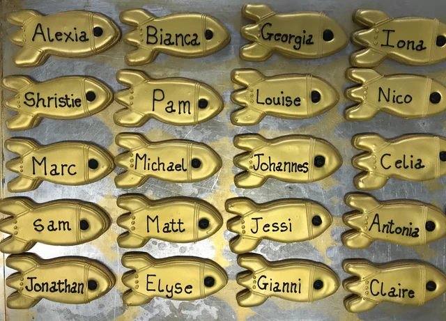 Hand piped bespoke biscuits to be used as table names for a wedding