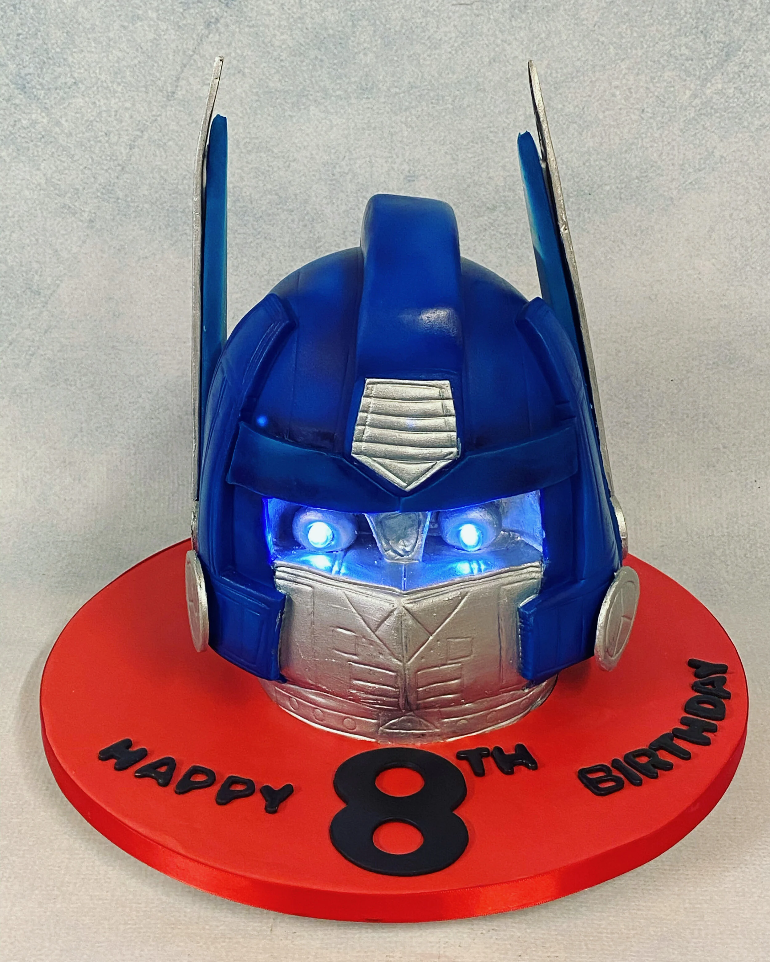 Optimus Prime head cake with working light eyes