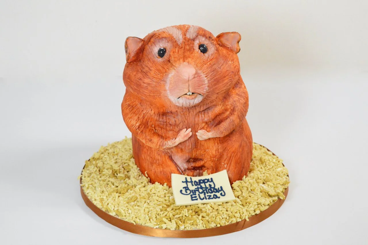 A cake sculptured into the shape of a hampster.