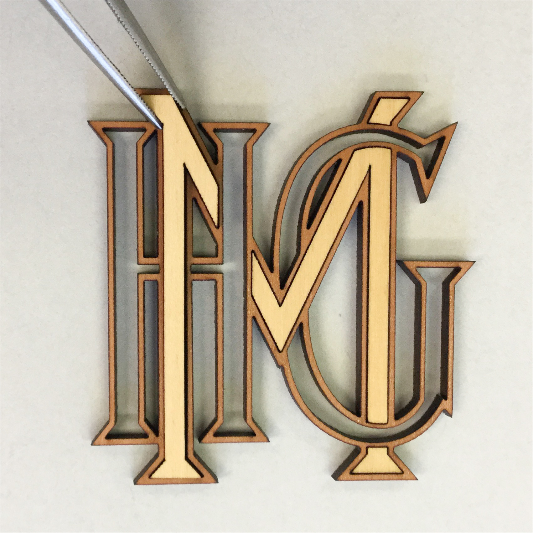 For a pair of 19th-century piano stools Pike meticulously recreated the monogram inlays, which had been removed by a previous owner, out of several types of wood.