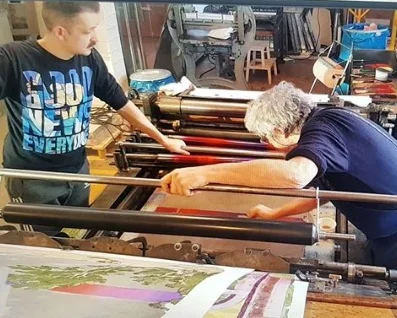 Patrick and Ernst working on a Schnellpresse (lithographic fast-press)