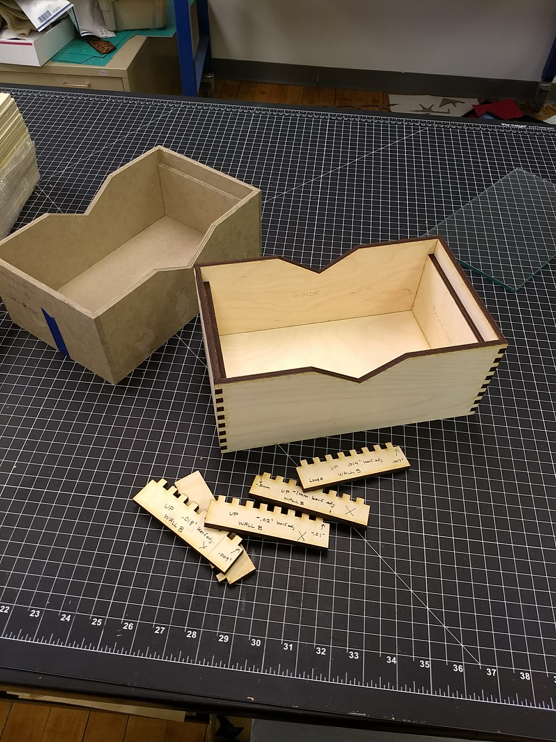 Sarah’s mock-up (left) - kerf tests (front) - prototype (right)