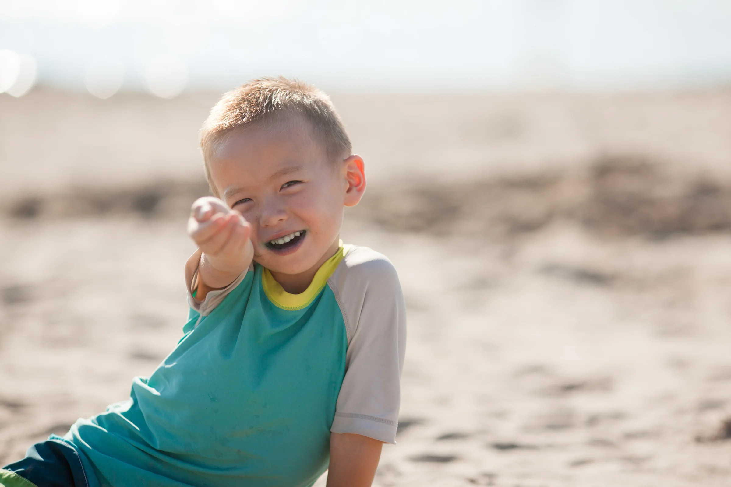 Instead of having your subject face the sun, put the sun behind them. Now the light on Jack's face is softer and more diffuse. Do you see the difference? Look at how much happier he is now he is not squinting in the sun too!
