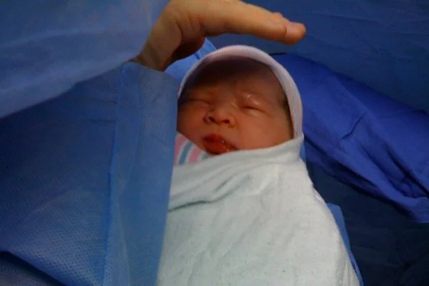 This is one of the first photos taken of Liam when he was born in early 2009... on my iPhone. This is exactly how I shared it a few weeks later when I first joined Facebook.