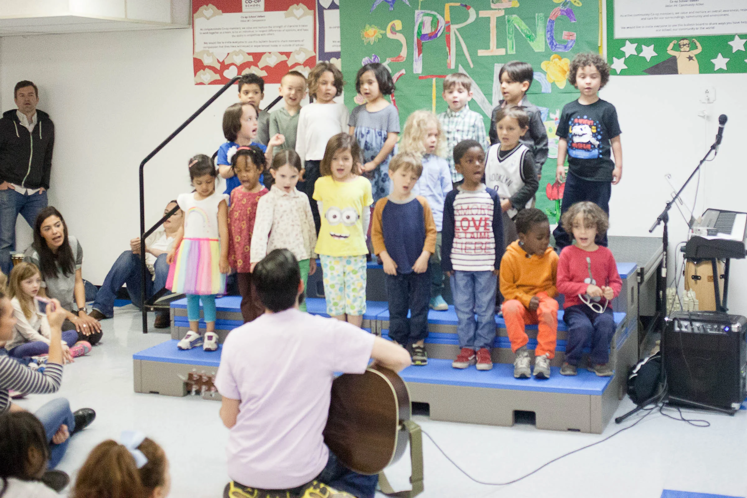 Jack's pre-K "spring sing" in the same room. This was the whole school so much more crowded so I couldn't choose my spot. This was cropped in so it appears I was closer than I was.