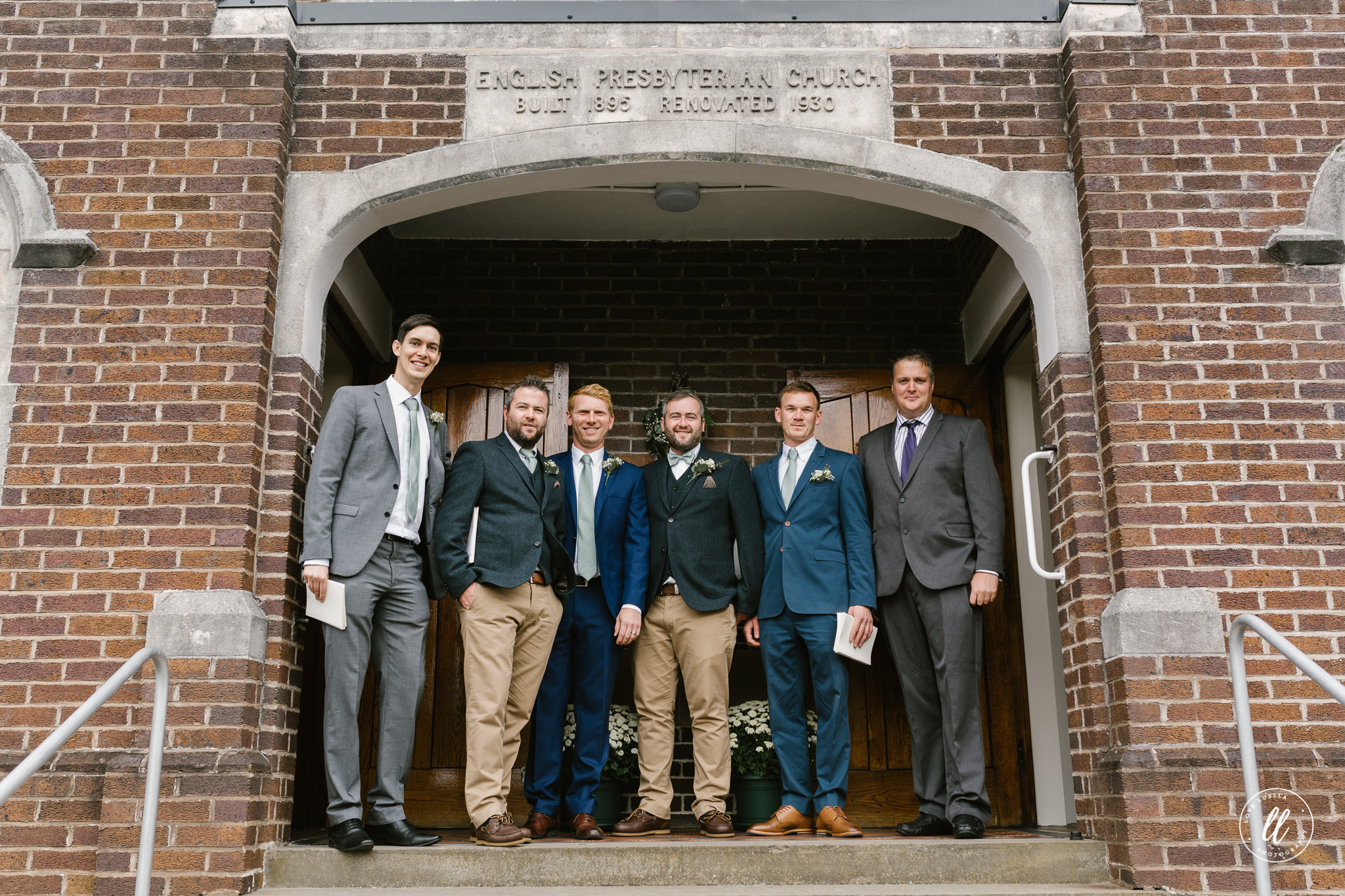 racing green groomsmen suits