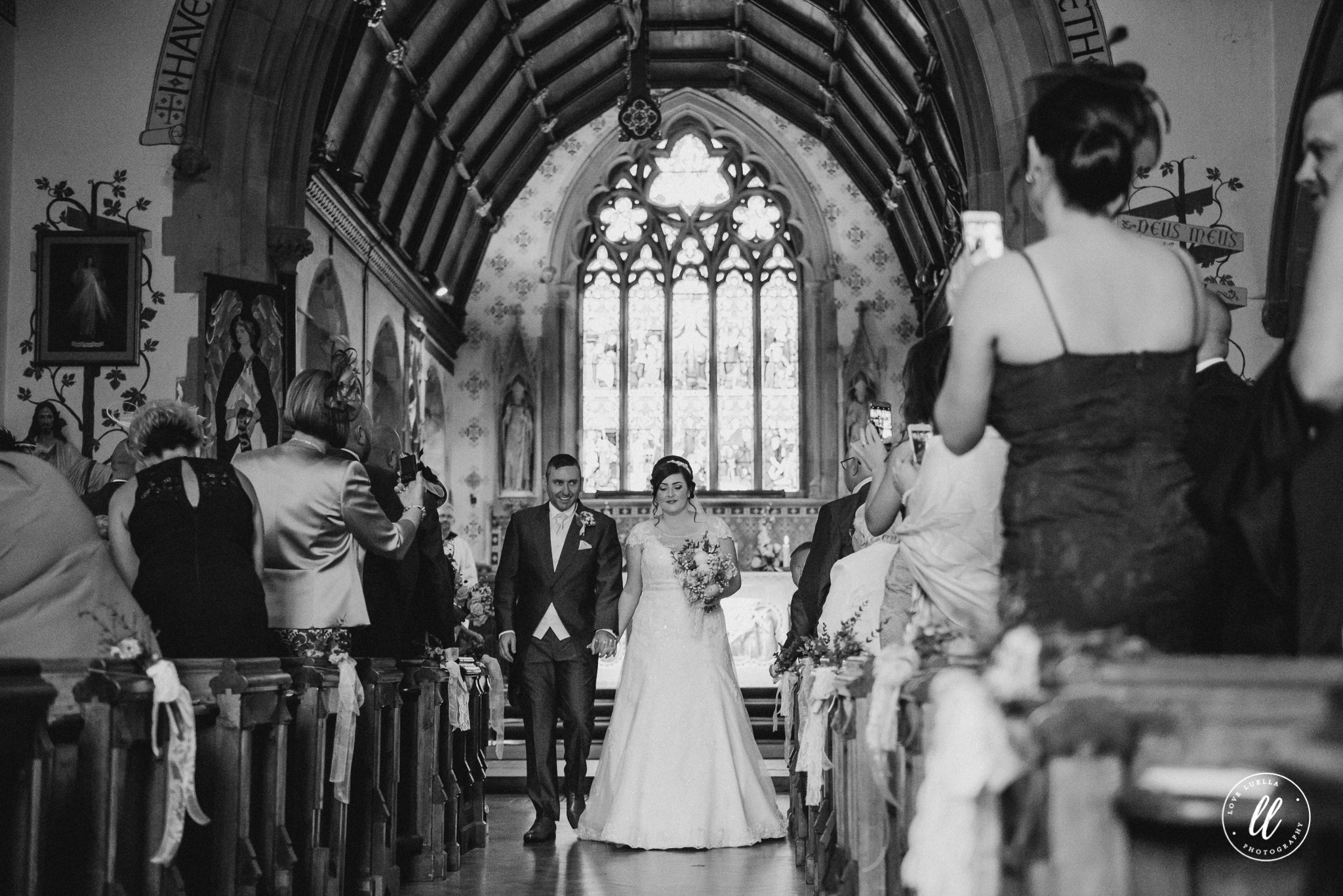 The new Mr and Mrs Jones begin their exit from Pantasaph Friary