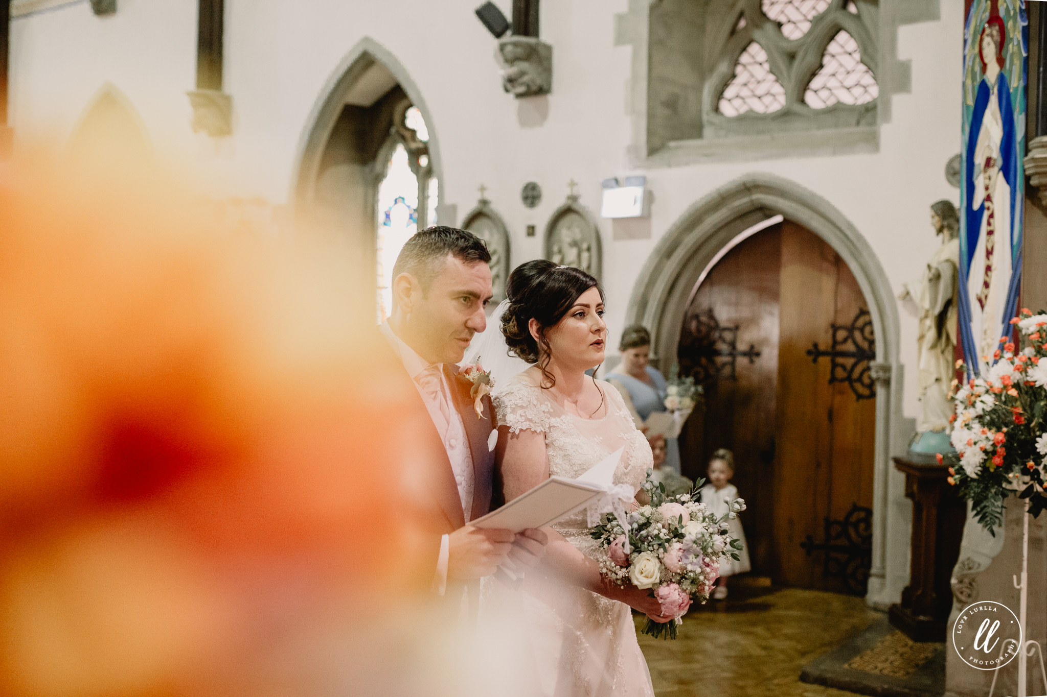 The couple listening to brother John read from the bible