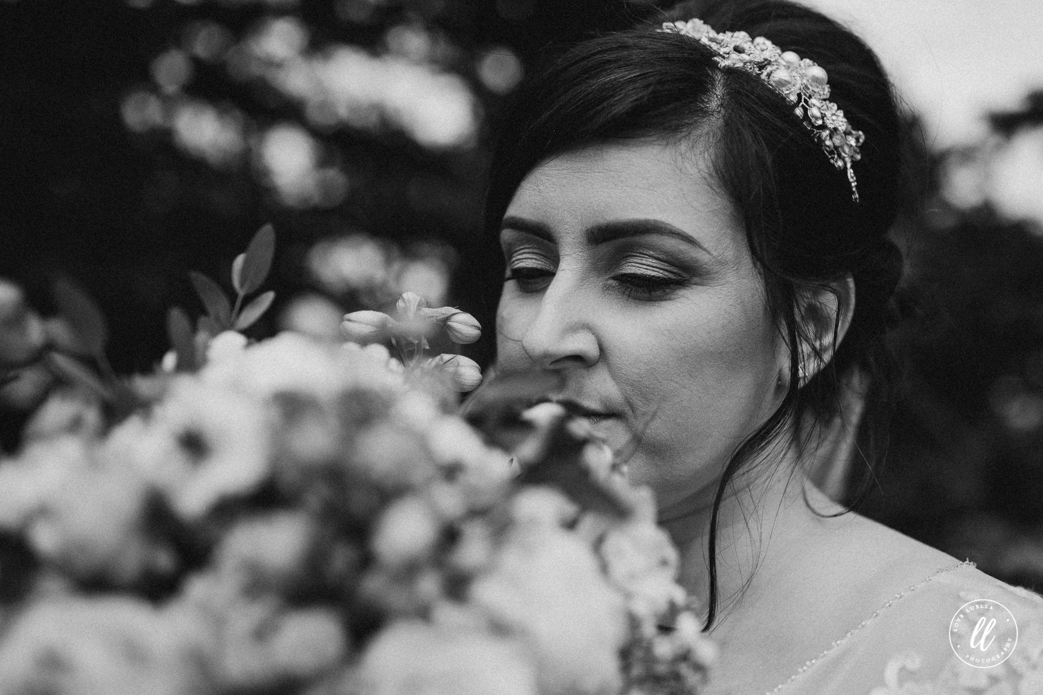 The bride smelling her flowers